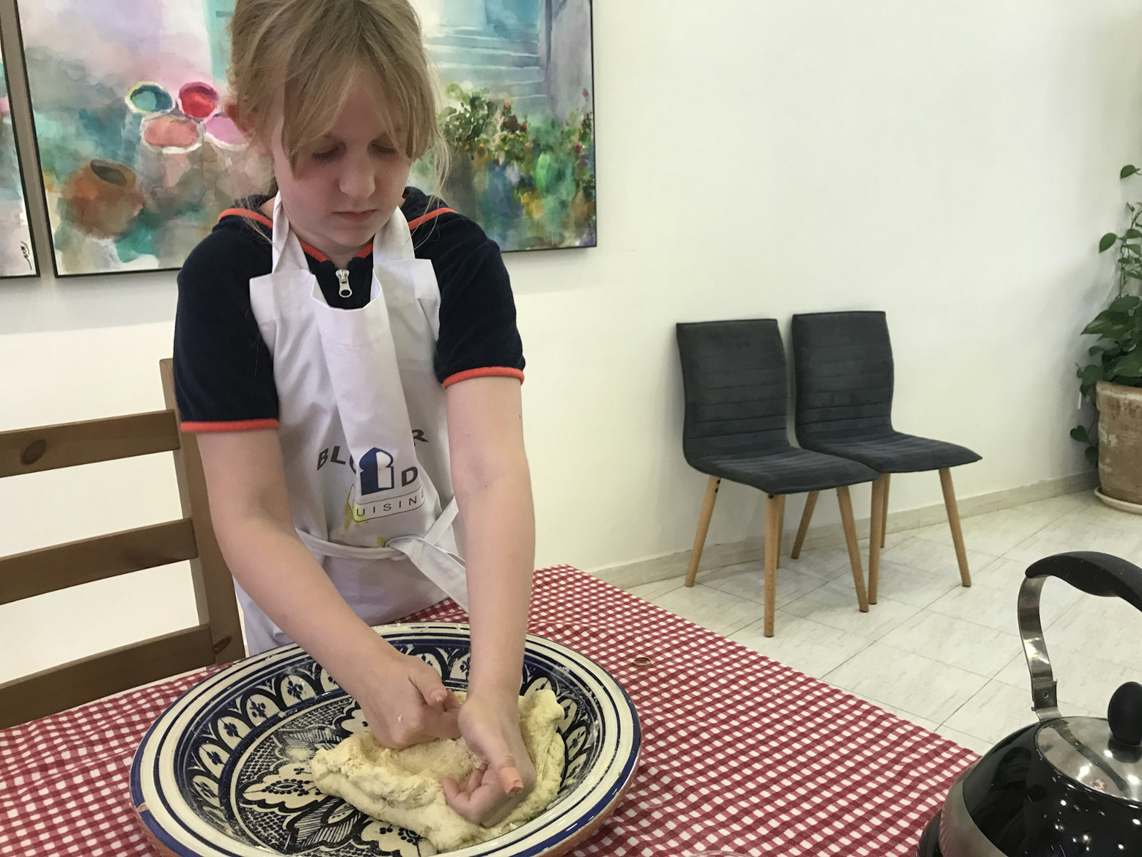 Tabby, looking like a true professional, making her own bread in Morocco