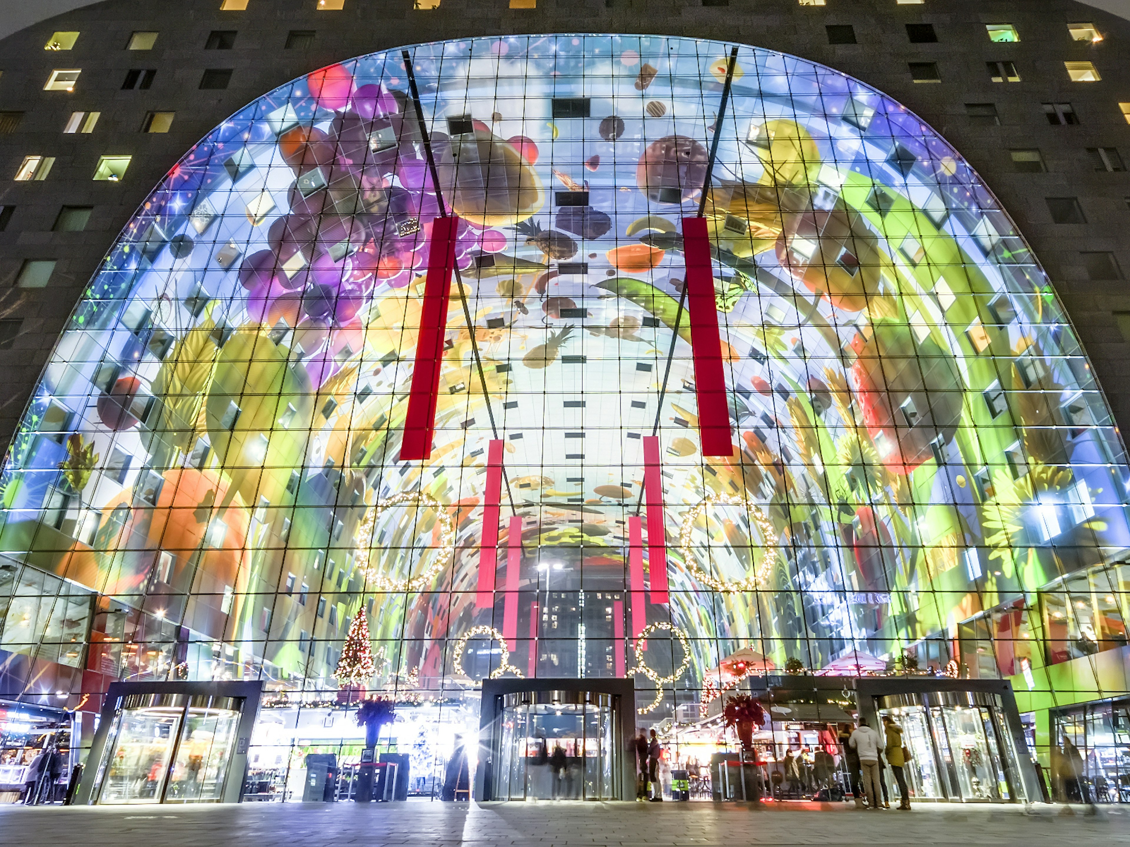 An exterior view of Rotterdam's Markthal lit up at night © Ankor Light / Shutterstock