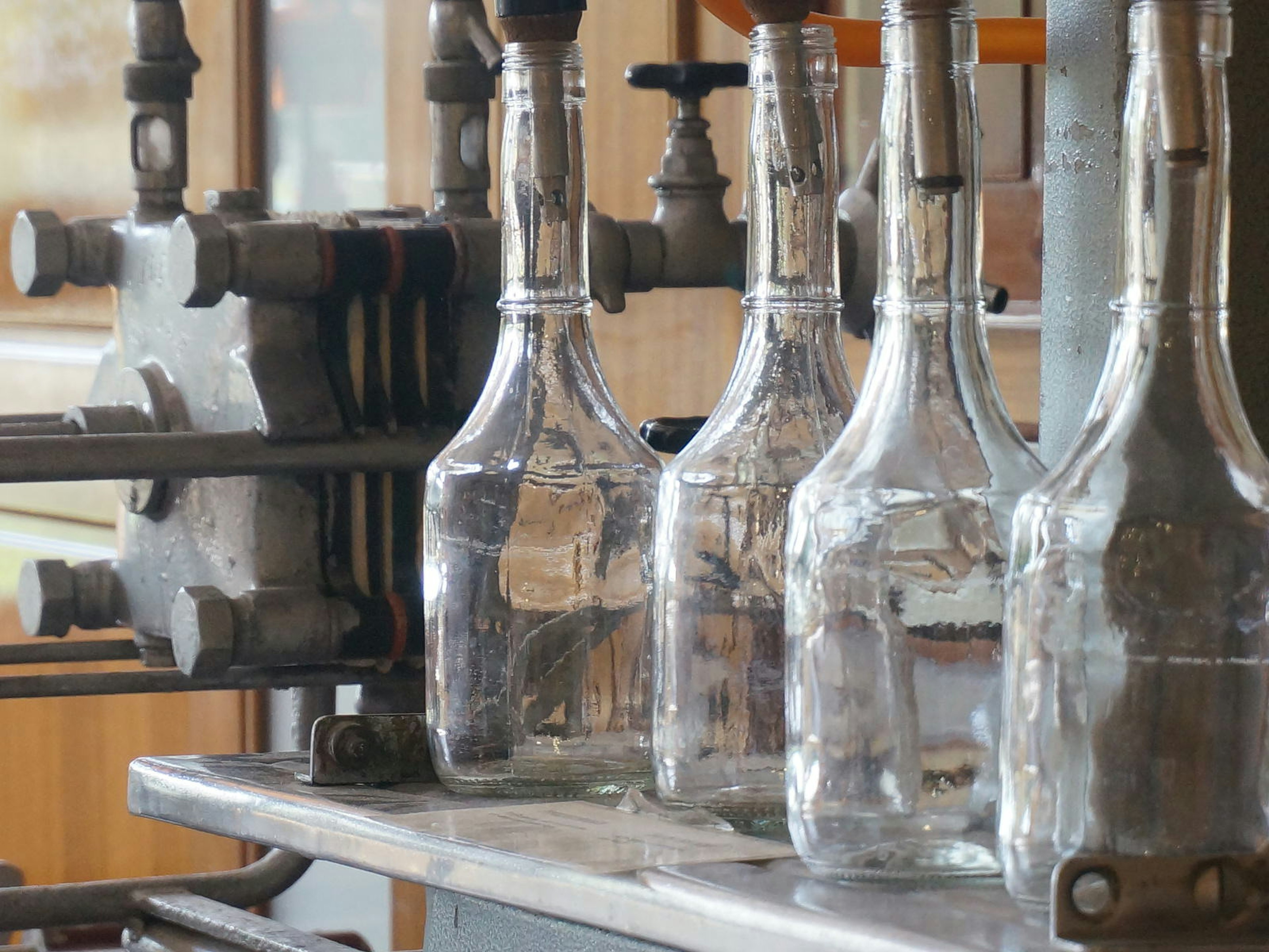 Copper presses and glass bottles for kumquat liqueur at Mavromatis © Anita Isalska / ϰϲʿ¼