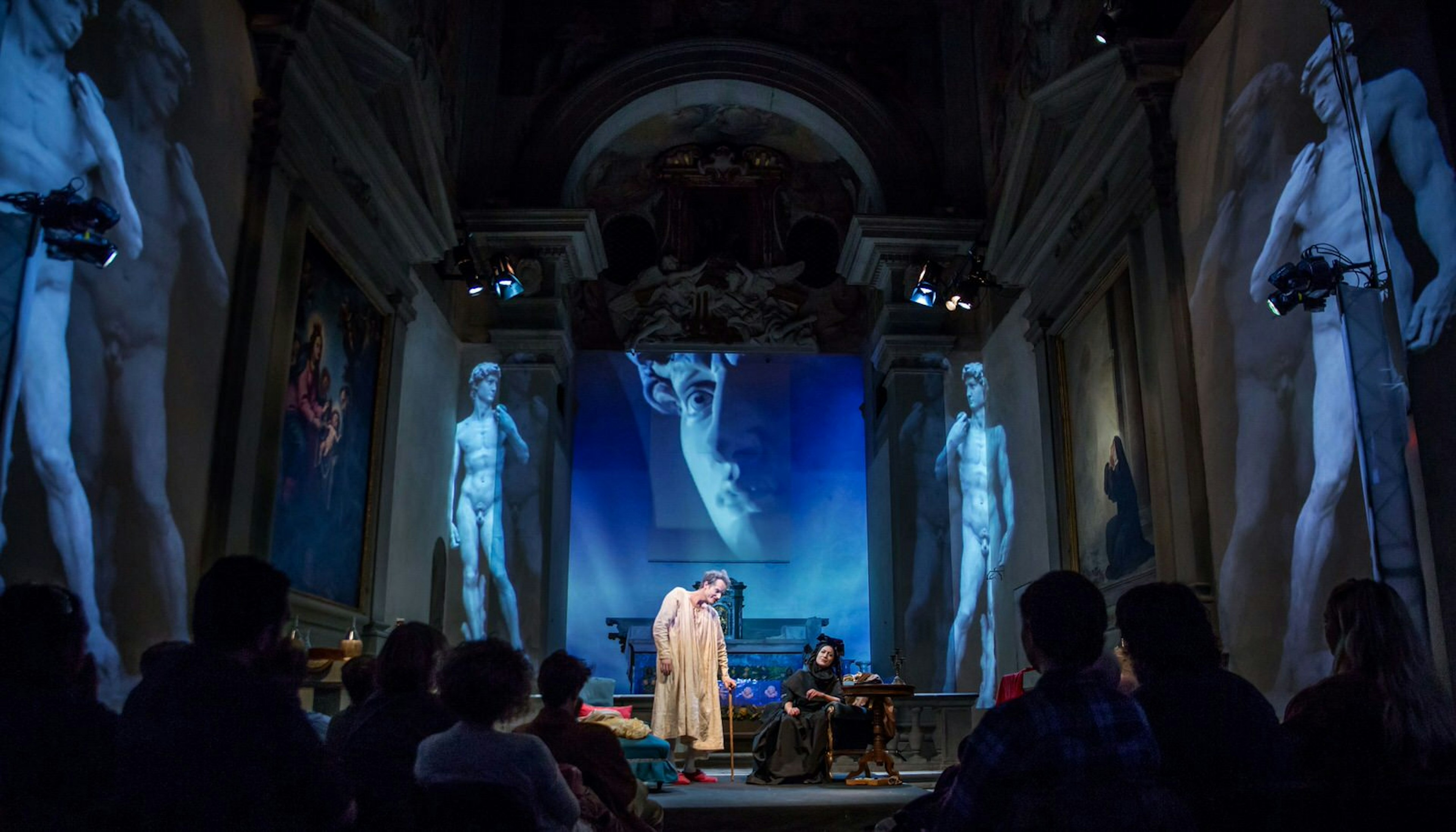 Two Renaissance-costumed actors on stage perform in the The Medici Dynasty Show