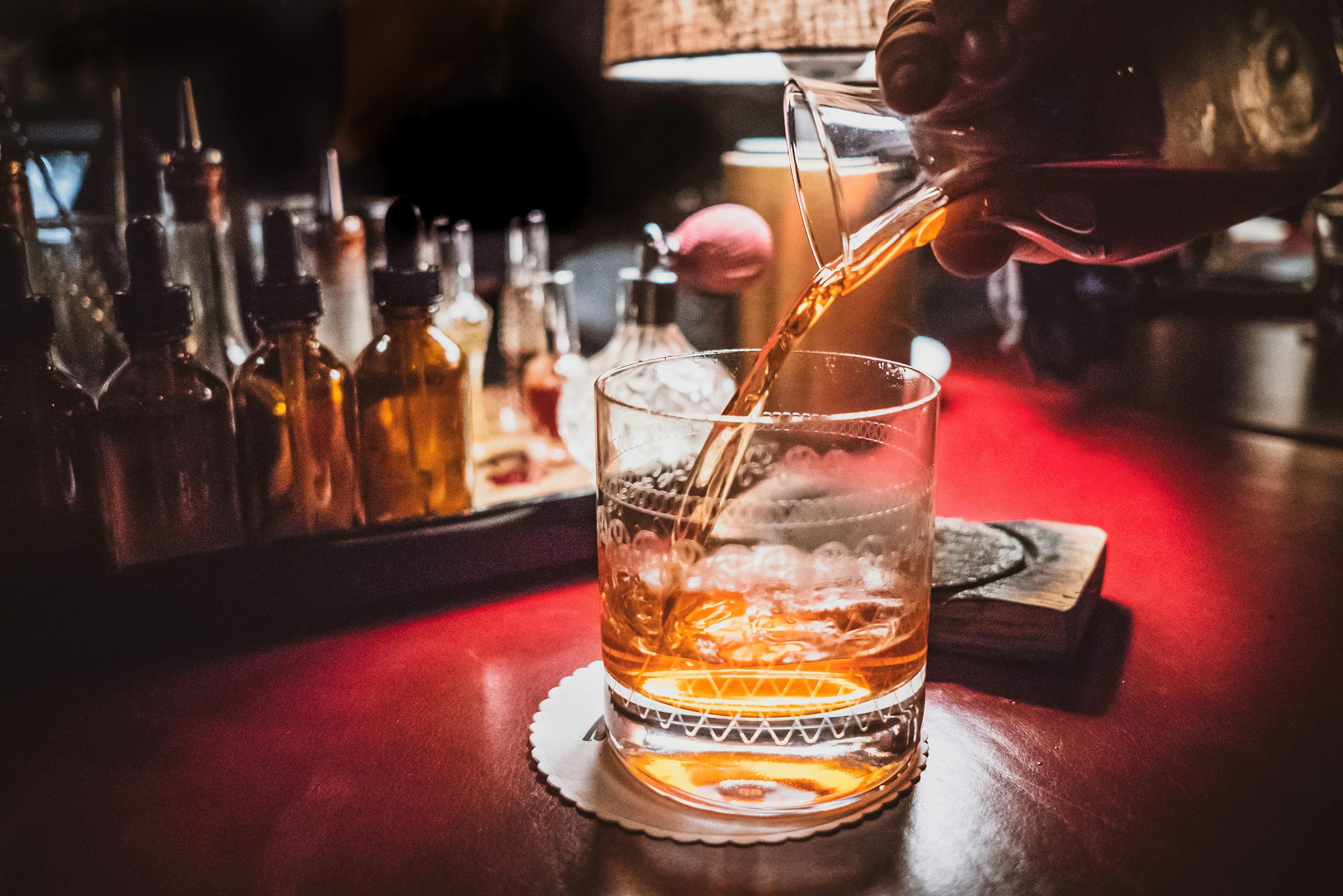 A glass of bourbon being poured at Mr. Lee's Lounge in Germantown. Photo courtesy of Louisville Tourism.