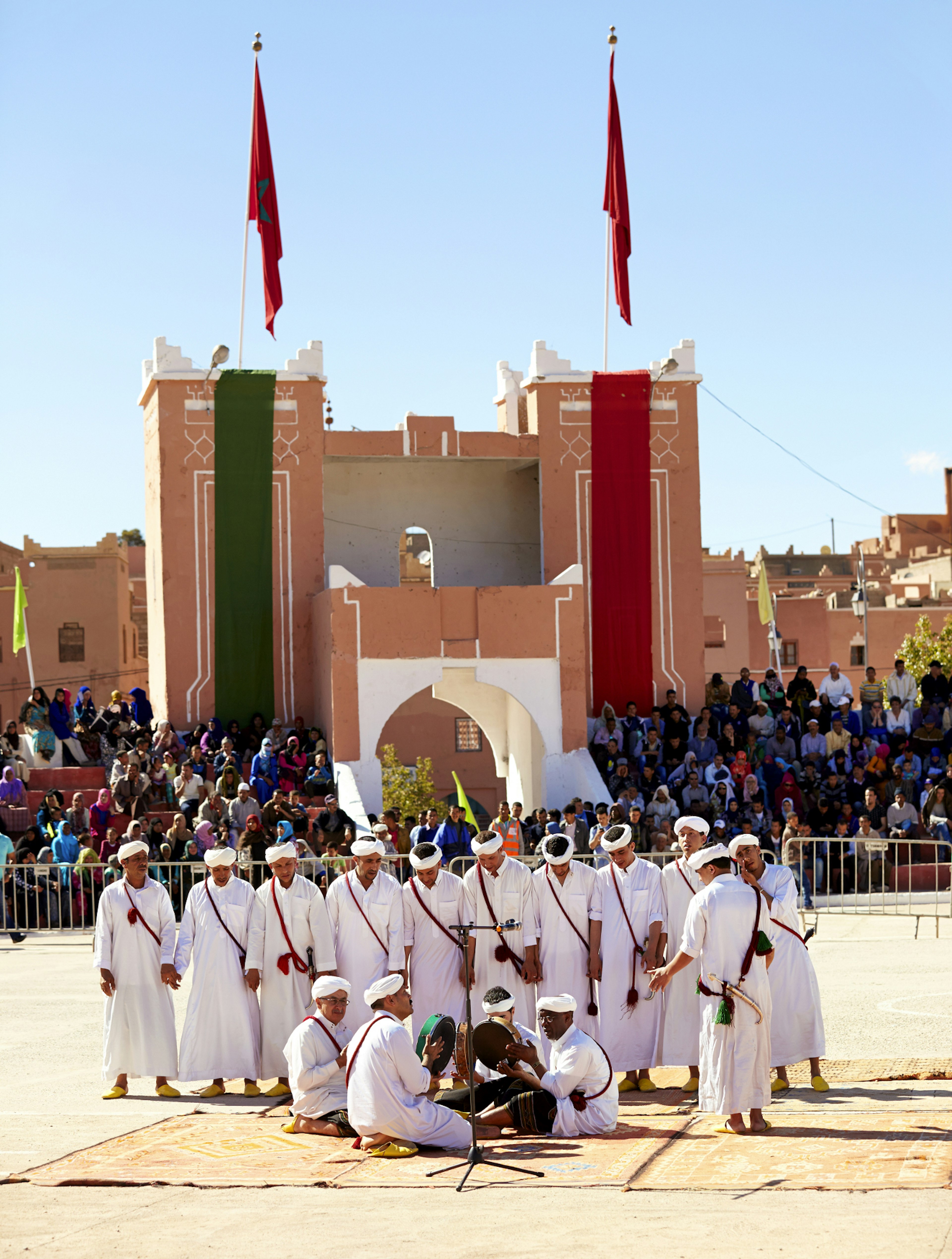 Men perform a traditional dance at the Rose Festival in Kalaat M'Gouna, Morocco