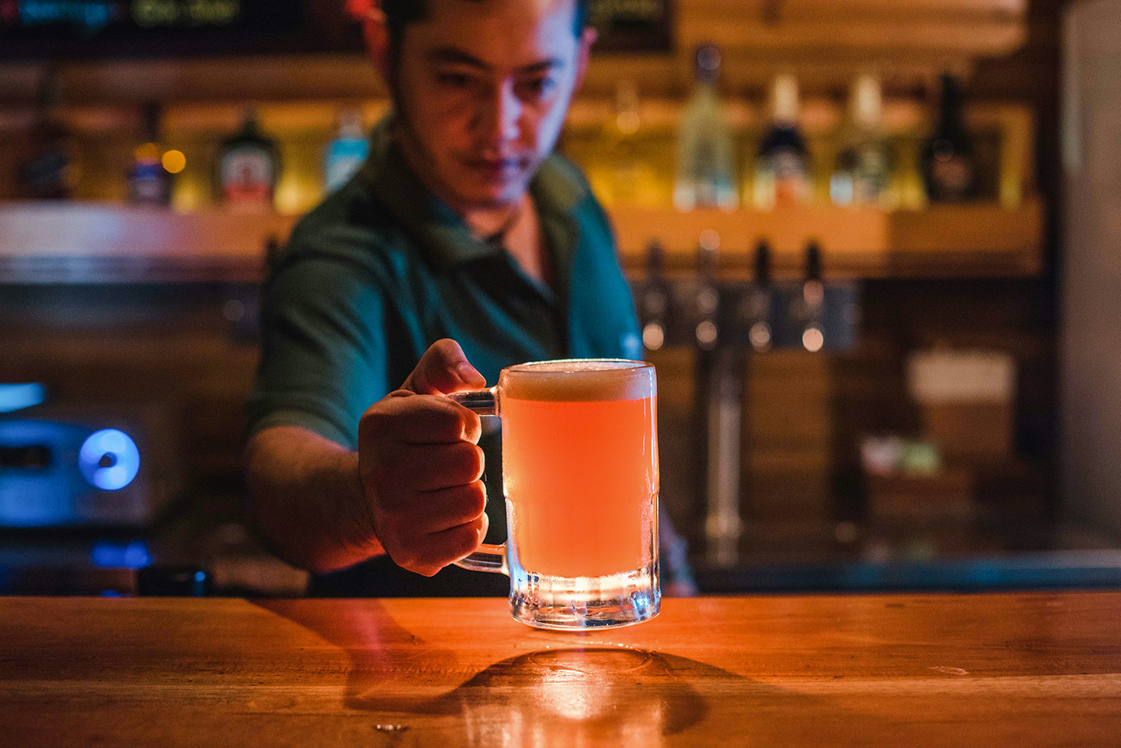 A bartender serves up a locally brewed beer at D&D Brewery. Image courtesy of D&D Brewery