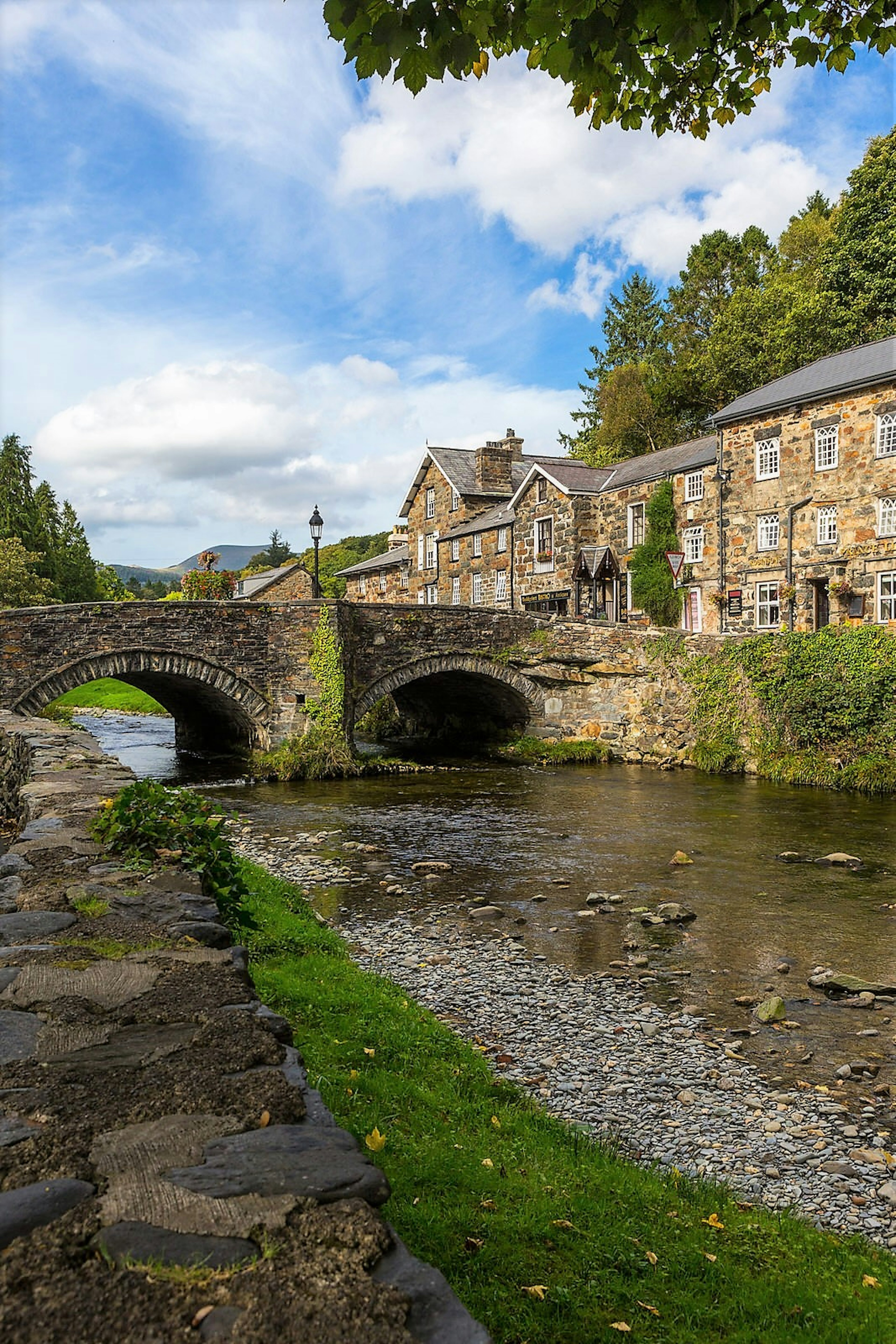 Stream running past quaint houses in Beddgelert © Crown copyright (2016) Visit Wales. All rights reserved.