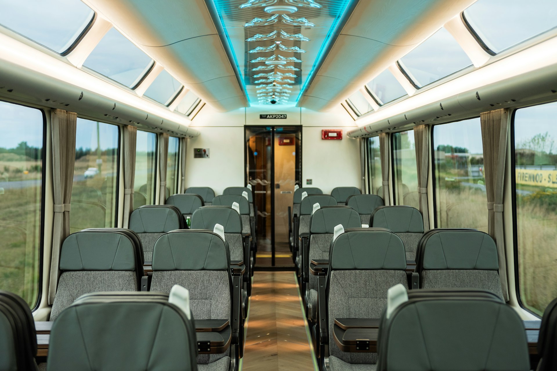 Interior of a train carriage with large windows