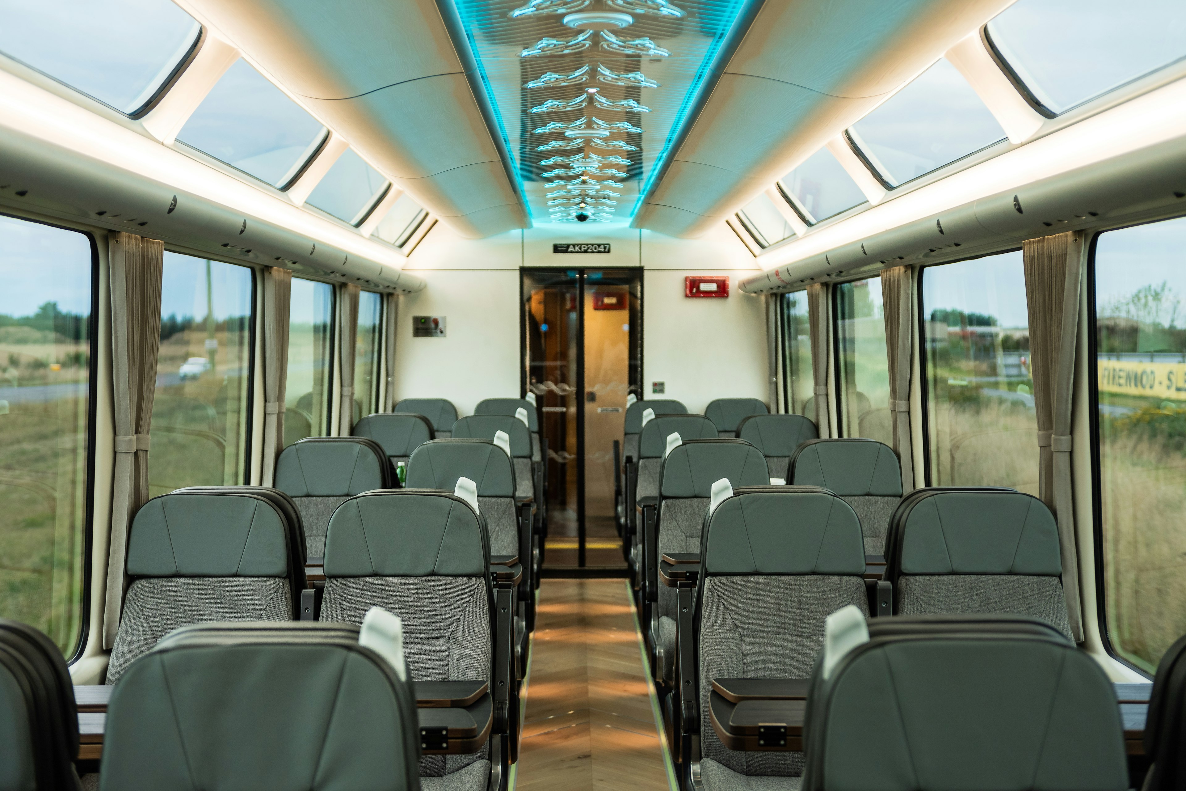 Interior of a train carriage with large windows