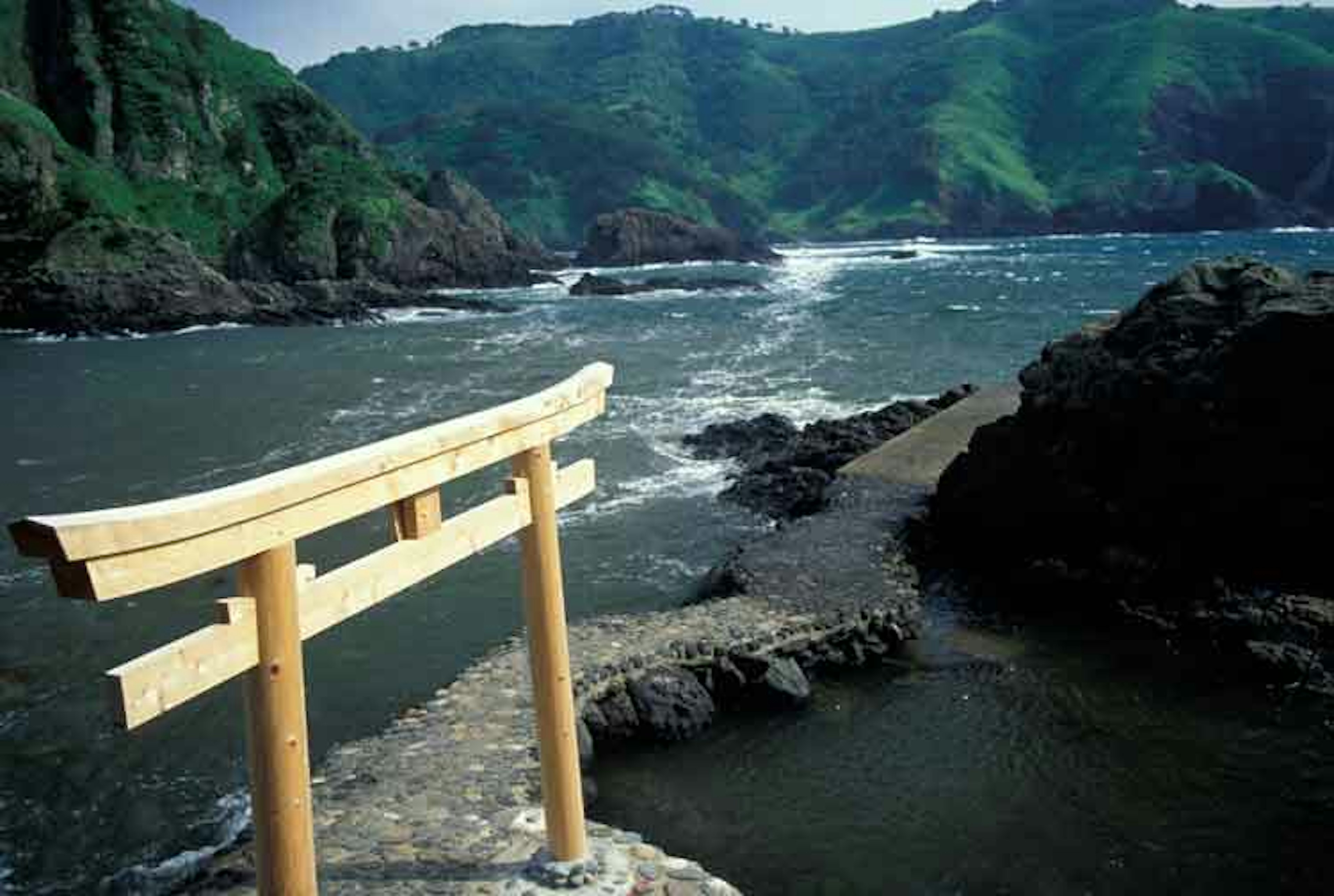 Wooden gate overlooking the ocean on the Oki Islands, Japan. Image by Jim Holmes / Axiom Photographic Agency / Getty Images.