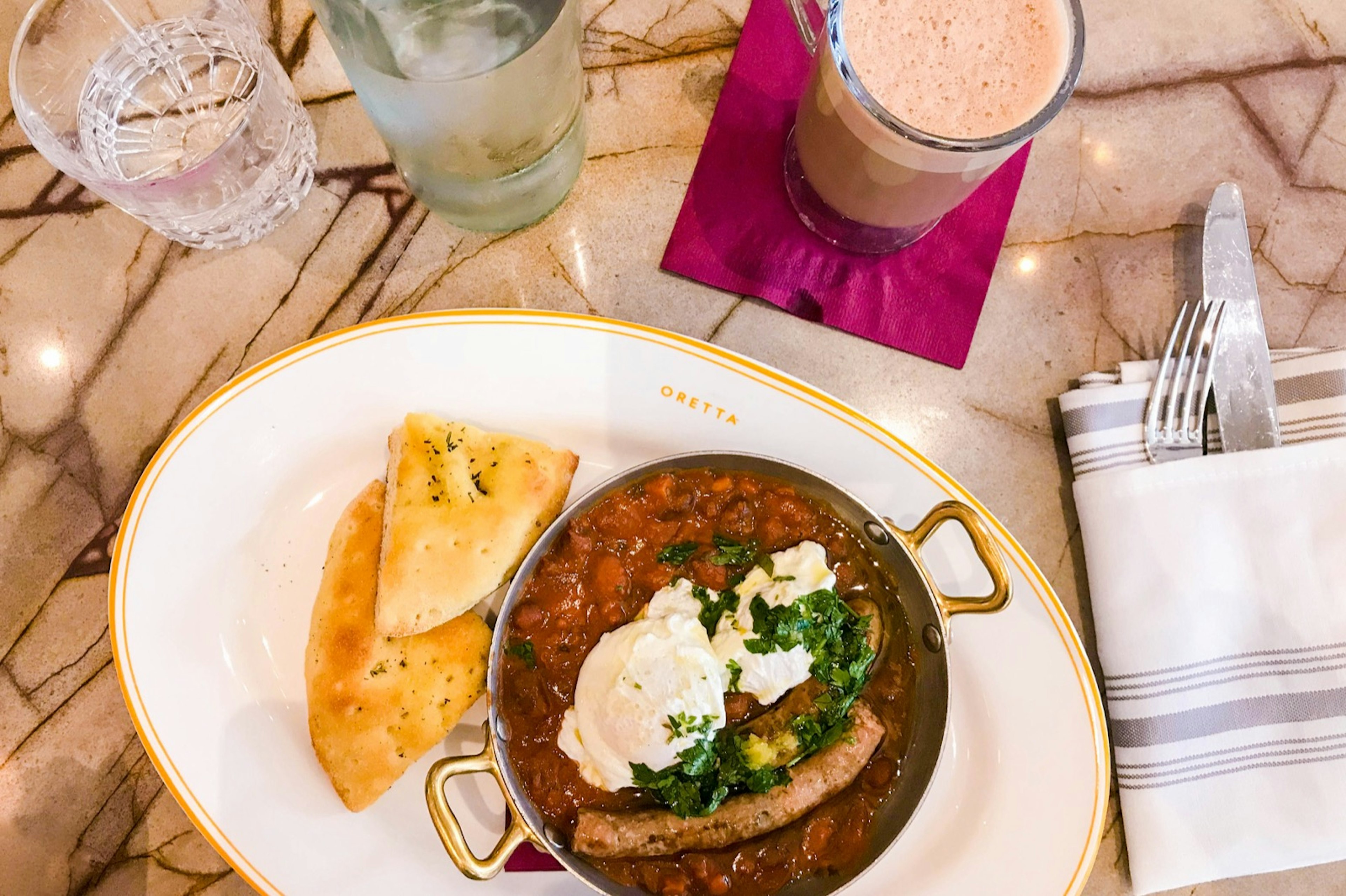 Looking down on a table covered in different brunch foods in Toronto