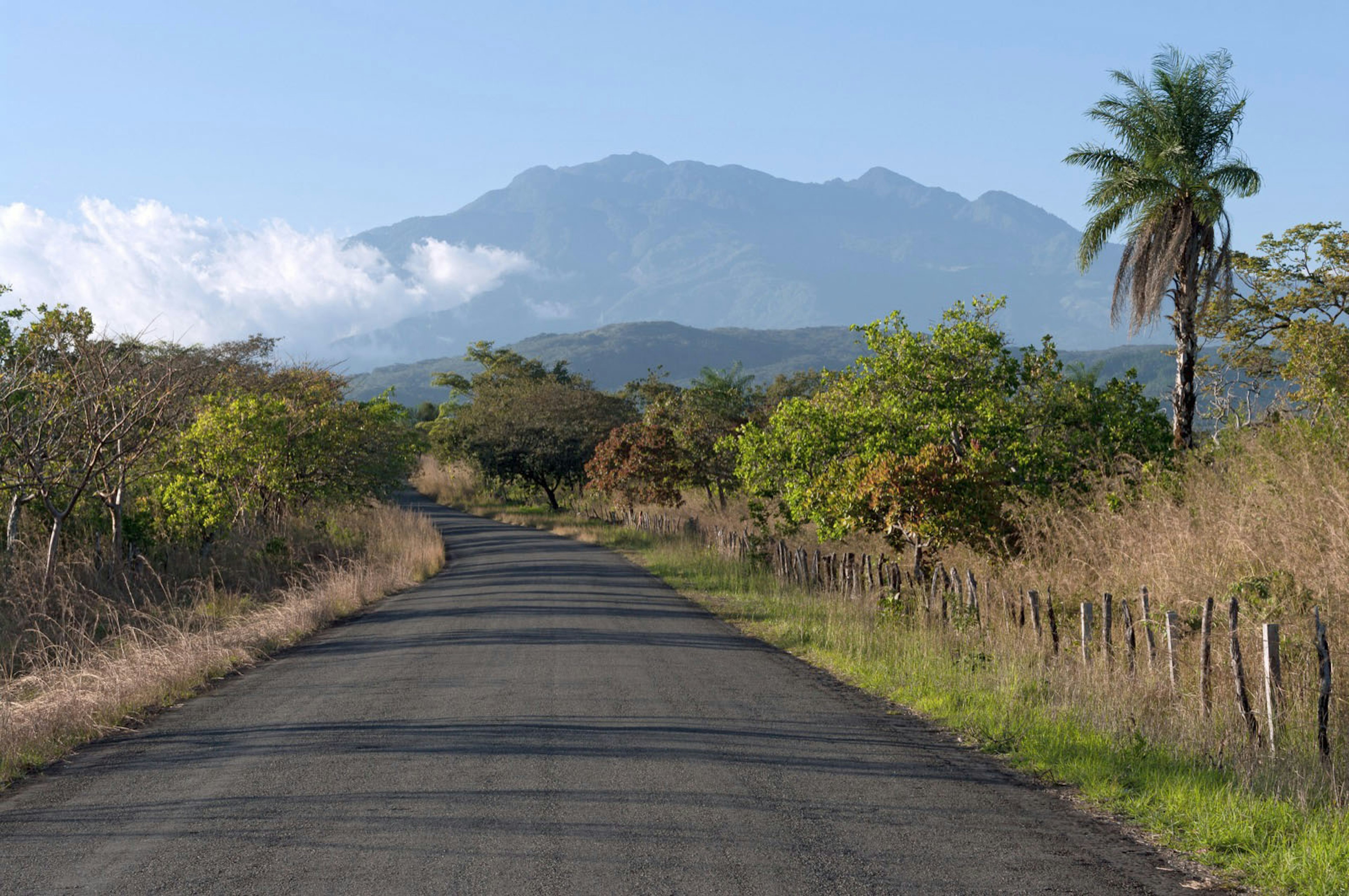 Country road in western Panama. The Volcan Baru in the background is the best known volcano in Panama Angel DiBillio / Shutterstock