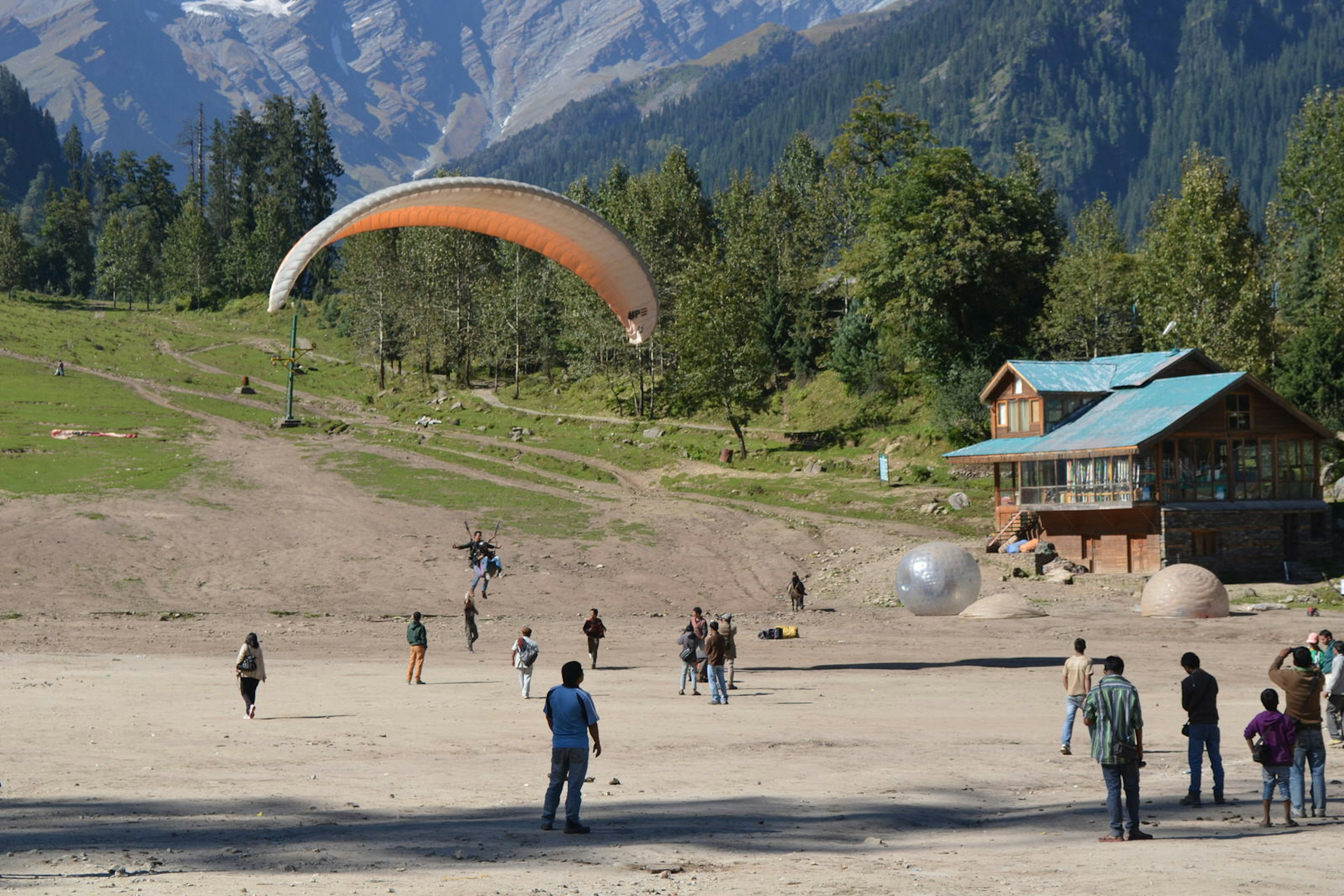 Paraglider landing at Solang Nullah in Himachal Pradesh