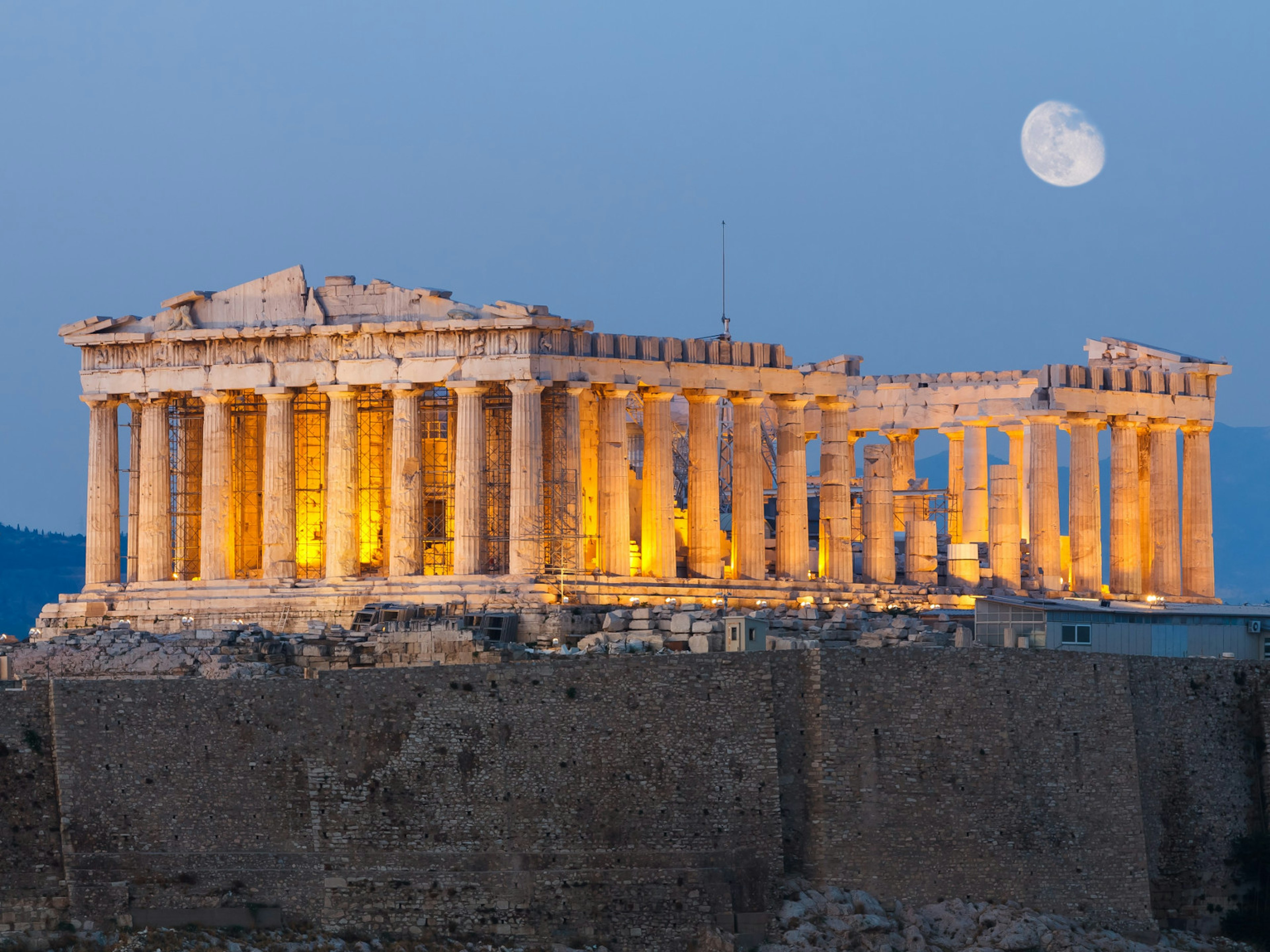 The ancient Parthenon on Acropolis hill in Athens in the early evening