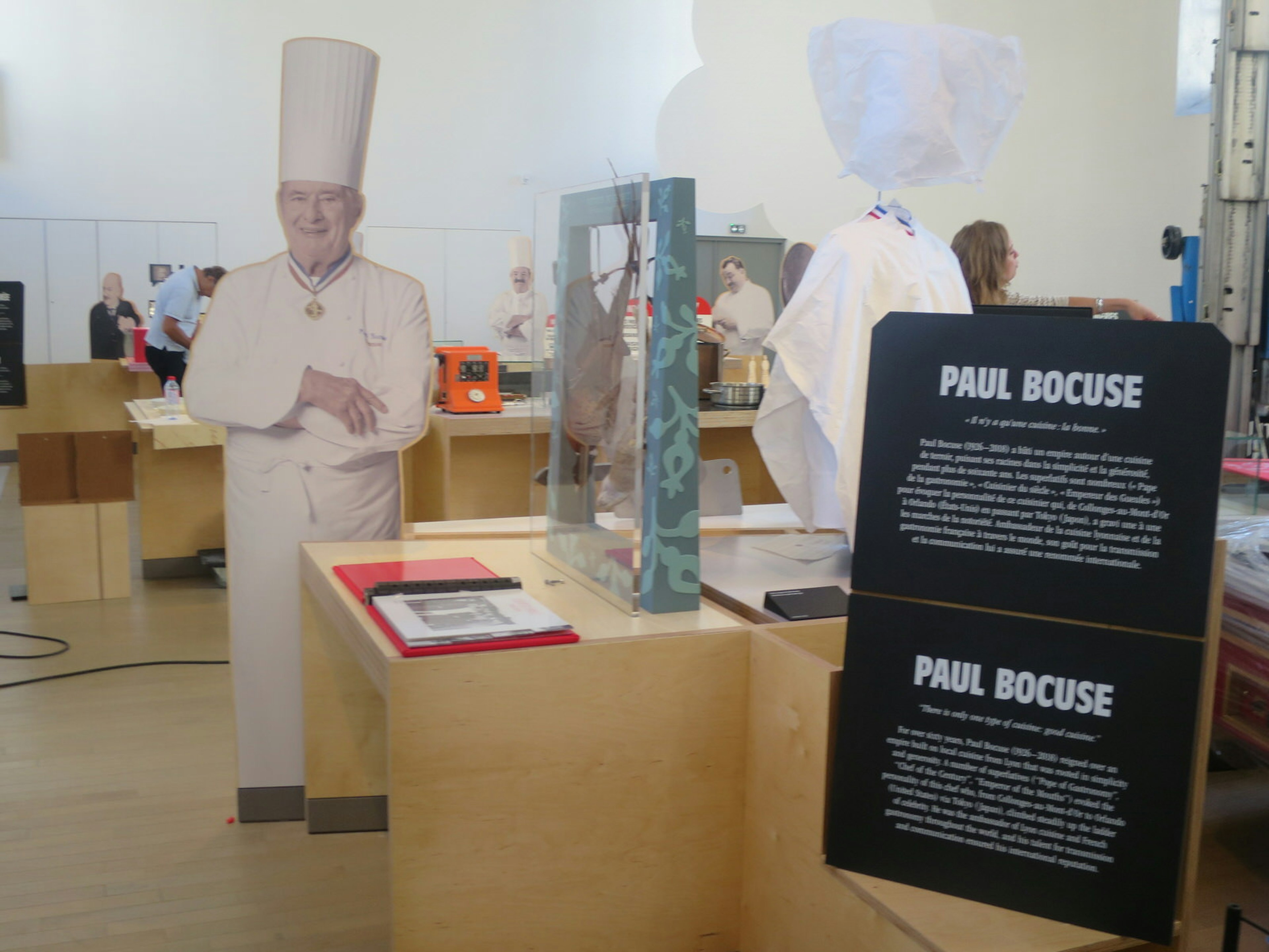 A display of chef Paul Bocuse's achievements including a life-size cutout of him