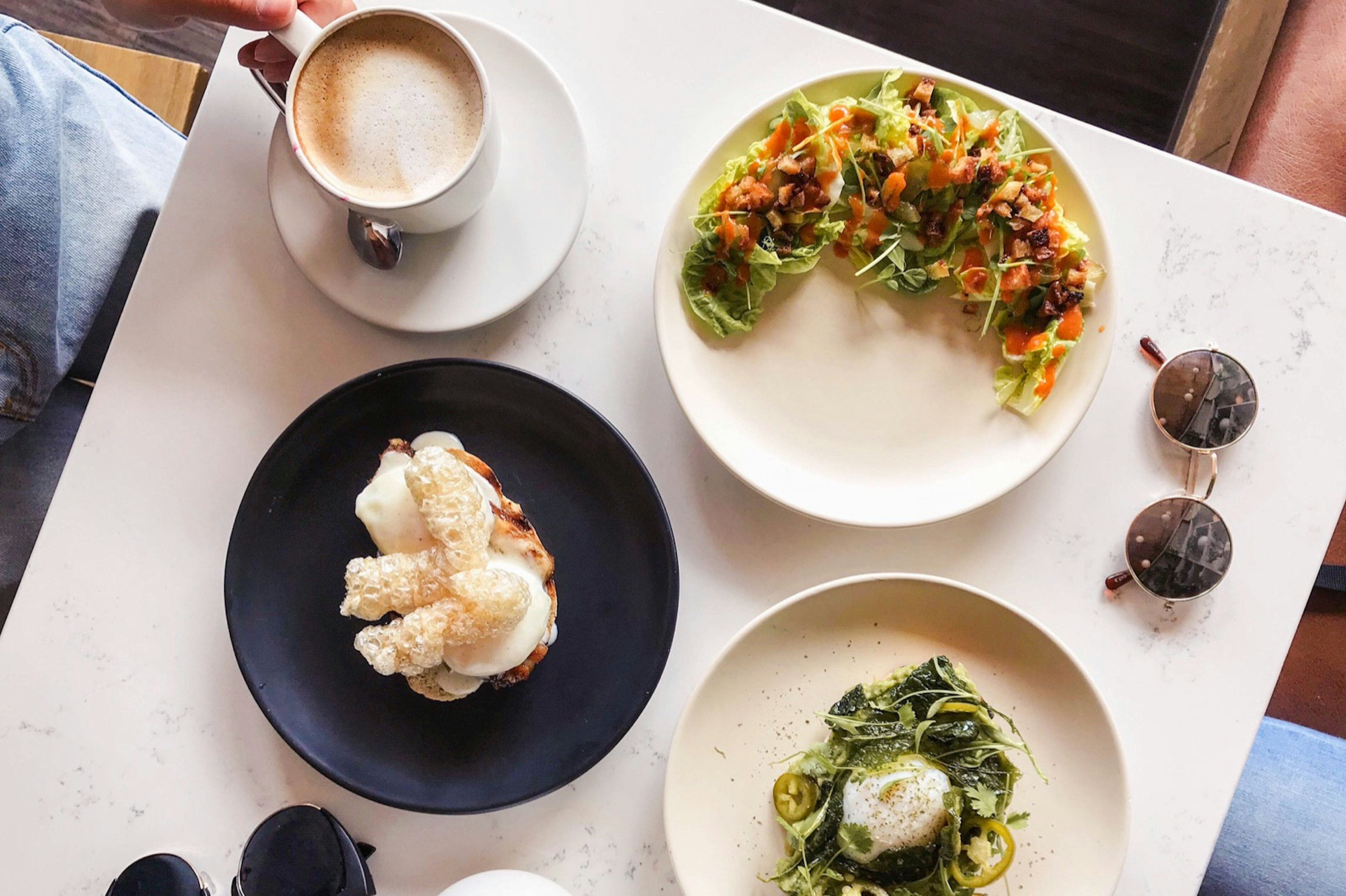 Looking down on a table covered in different brunch foods in Toronto