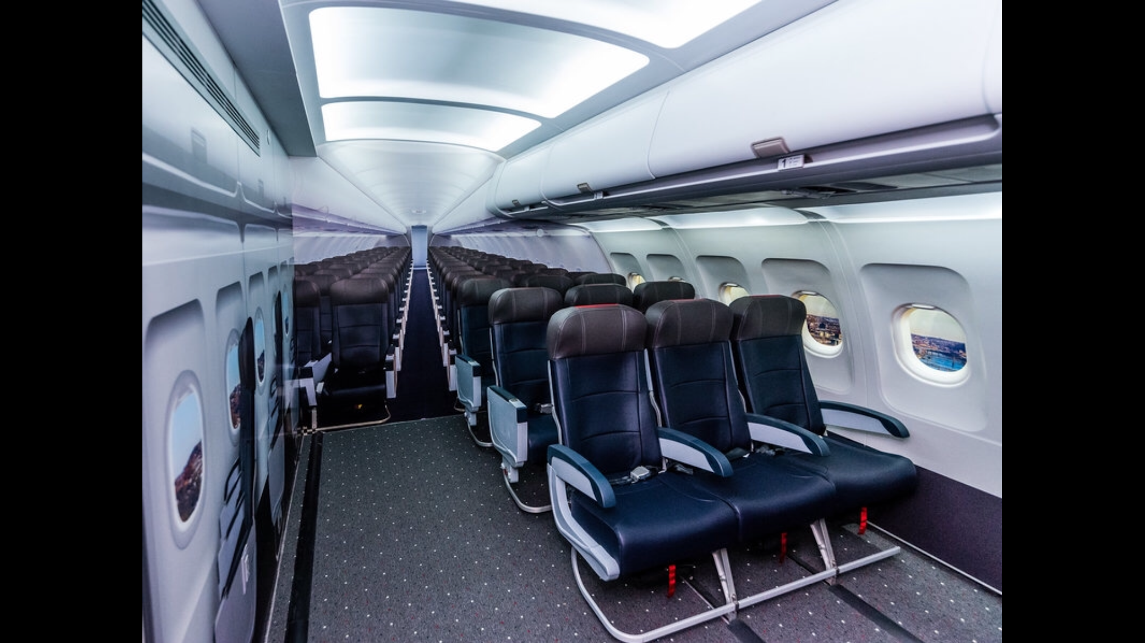 A replica of airplane cabin with seats and fake windows