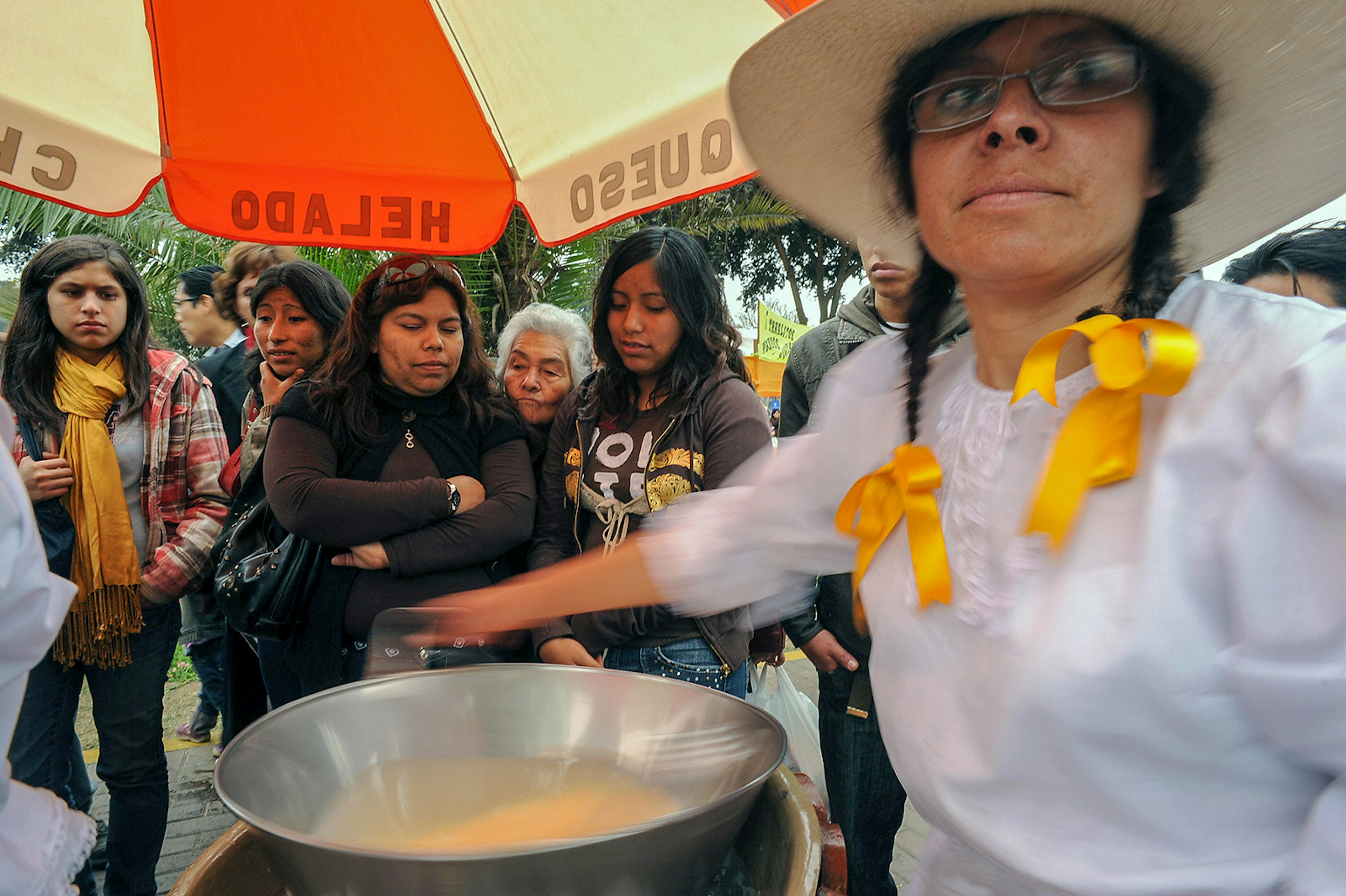 A cook stirs Queso Helado (Frozen Cheese)