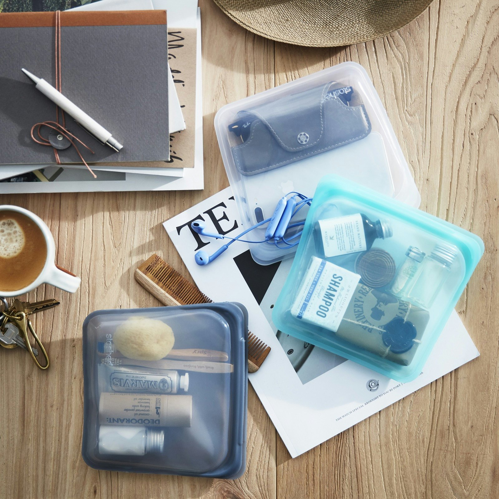 see through bags filled with a variety of personal care items on a desk