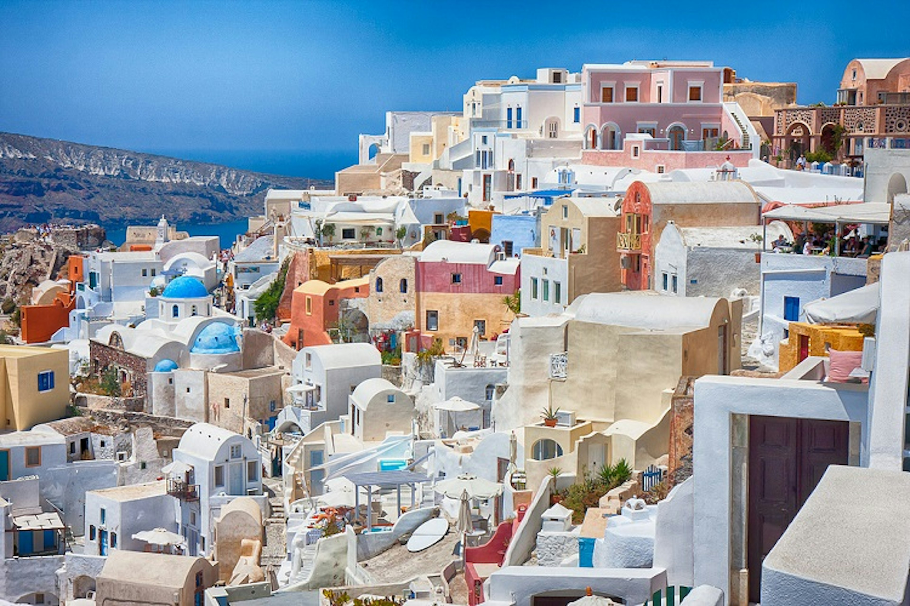 Santorini's colorful facades. Image by Edward Dalmulder / CC BY 2.0