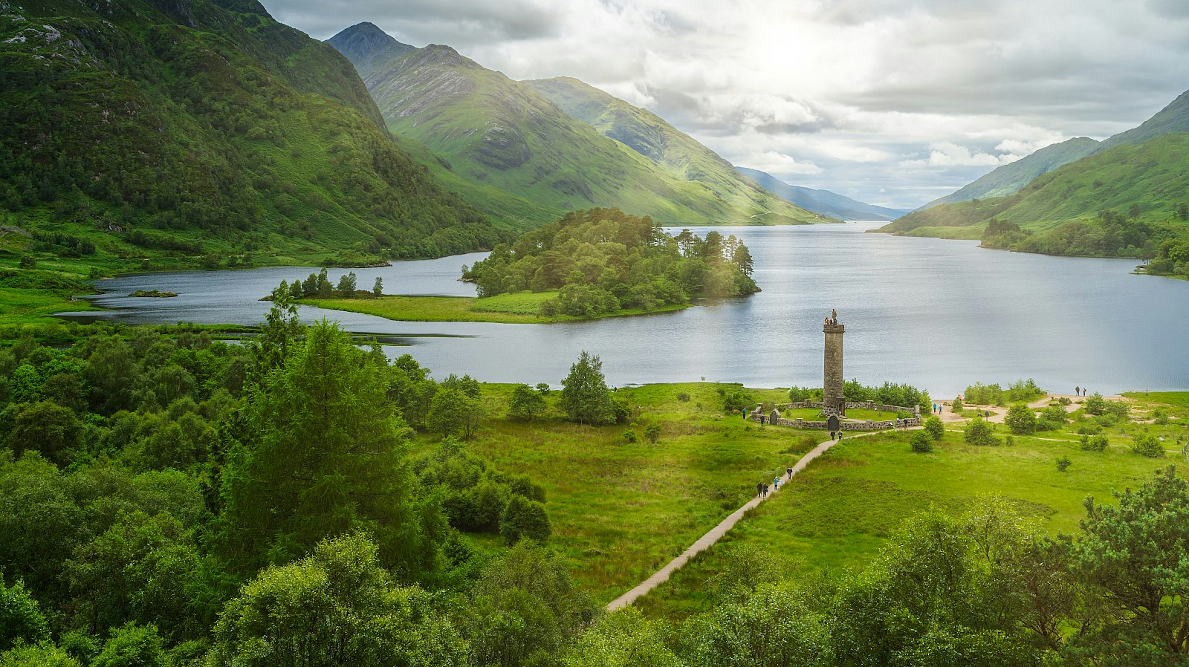 Glenfinnan Monument, amid greenery and mountains at the head of Loch Shiel in Inverness-shire, Scotland.