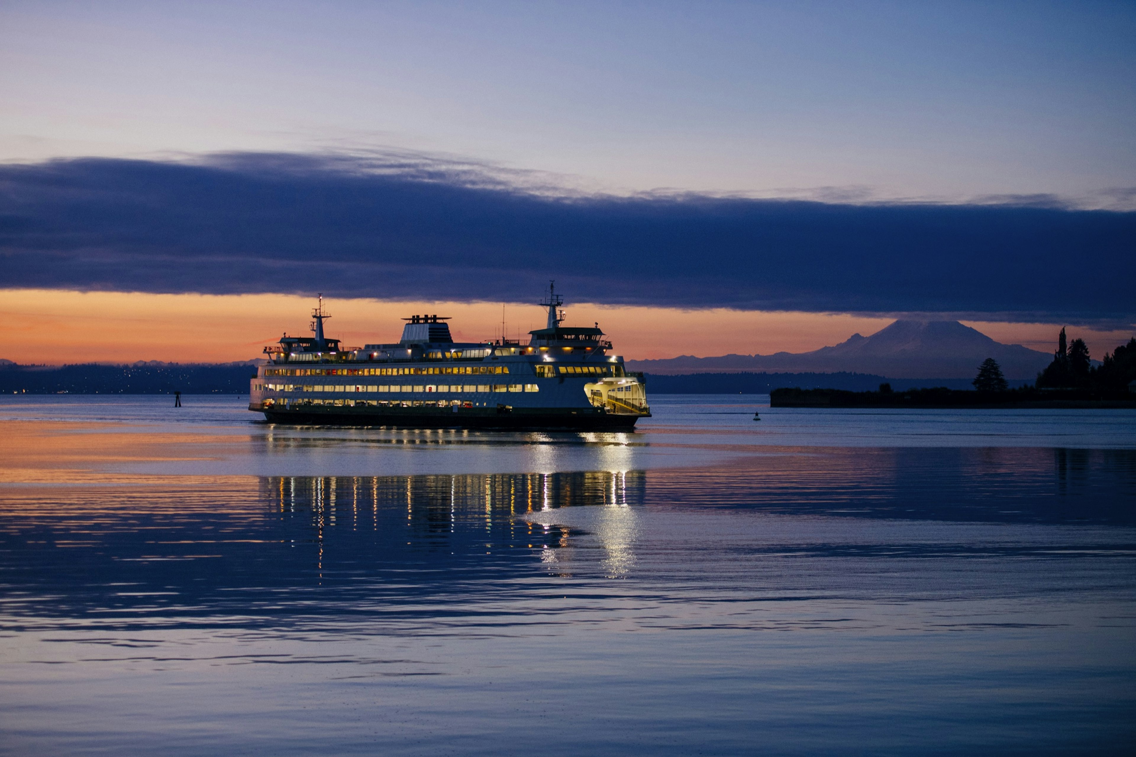 A ferry slips through Puget Sound off the coast of Seattle; Seattle Waterfront Activities