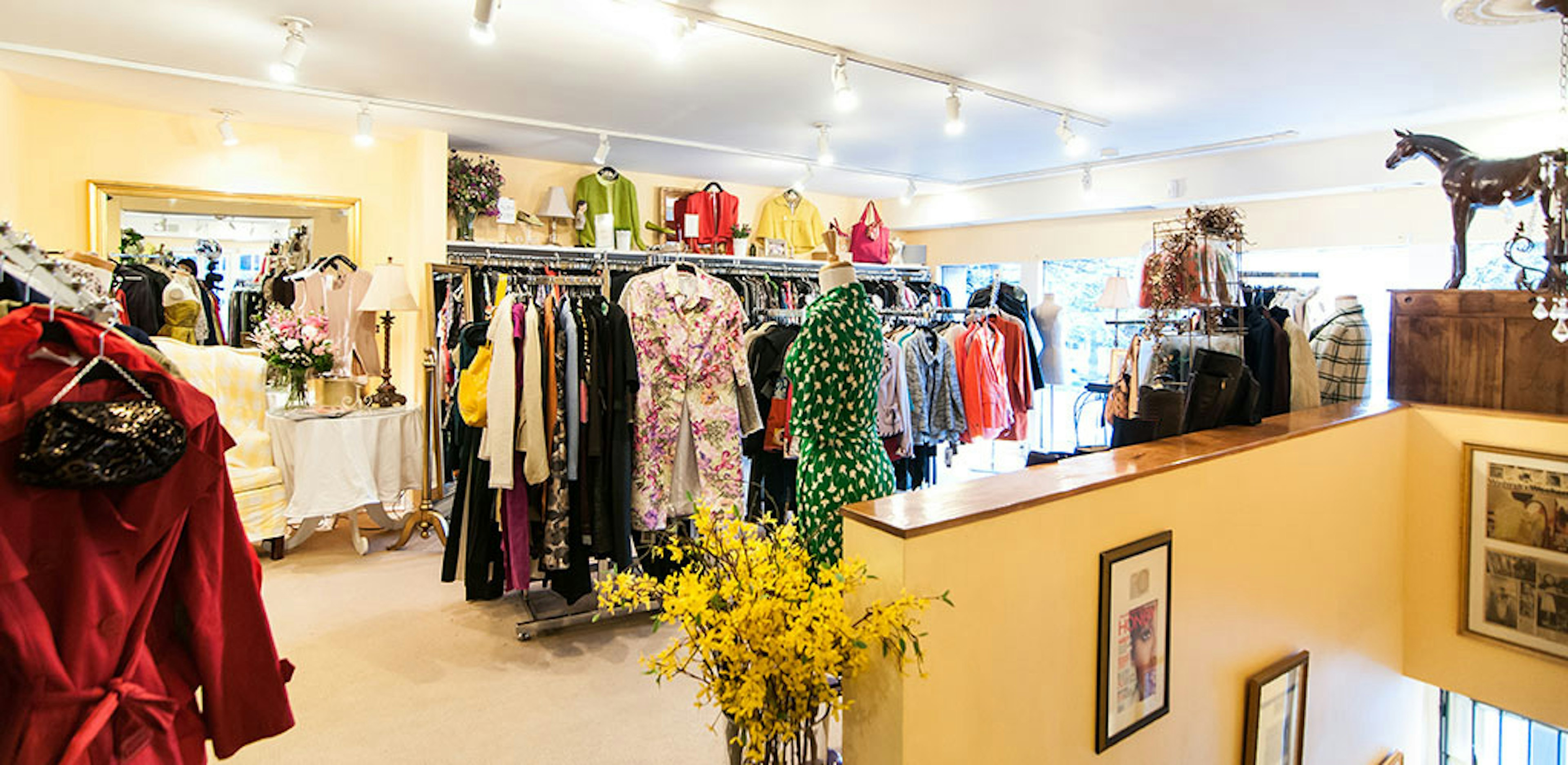 a rack of colorful clothing in a well-stocked store