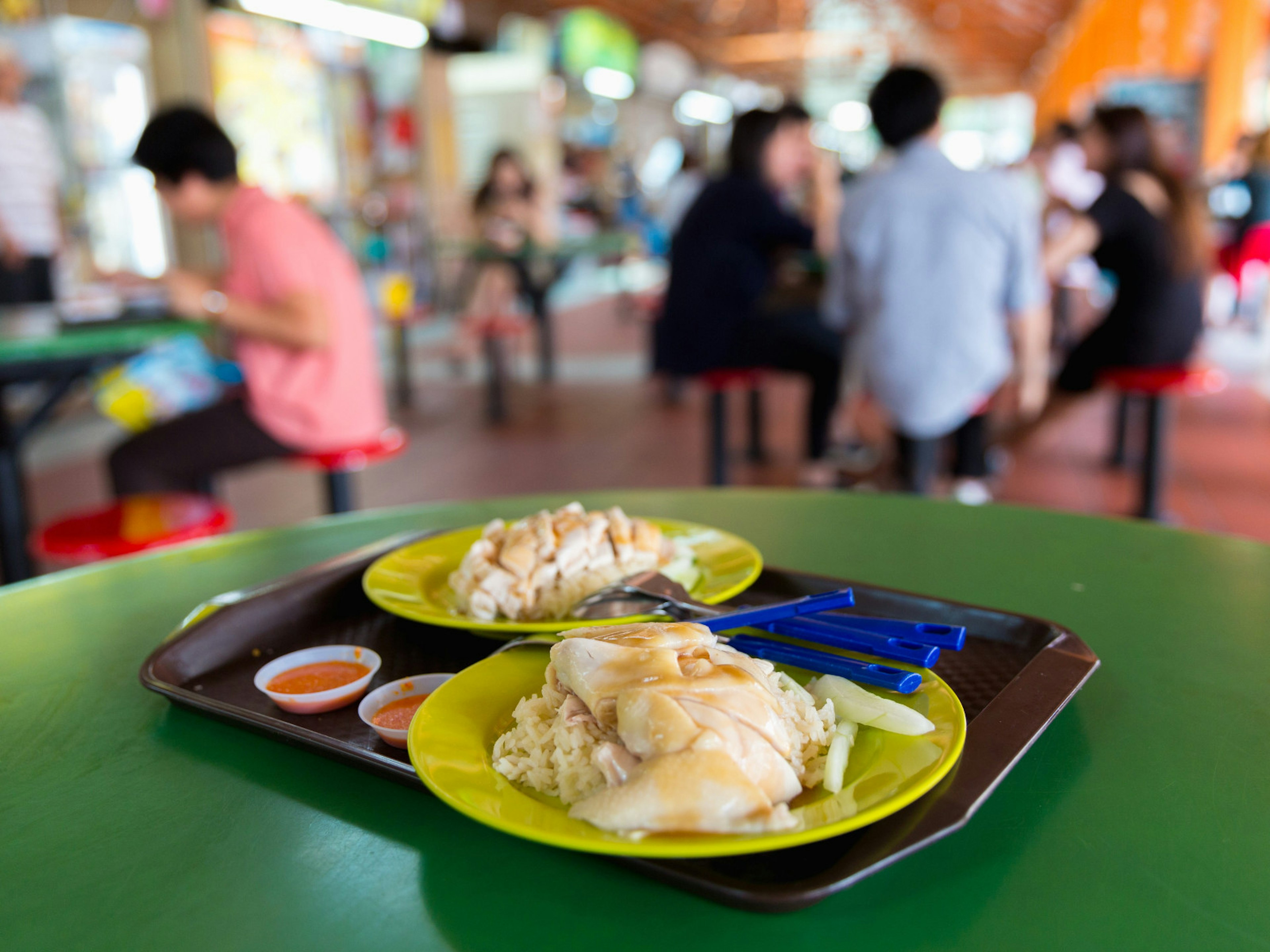 Plates of chicken rice served in Singapore's Maxwell Food Centre