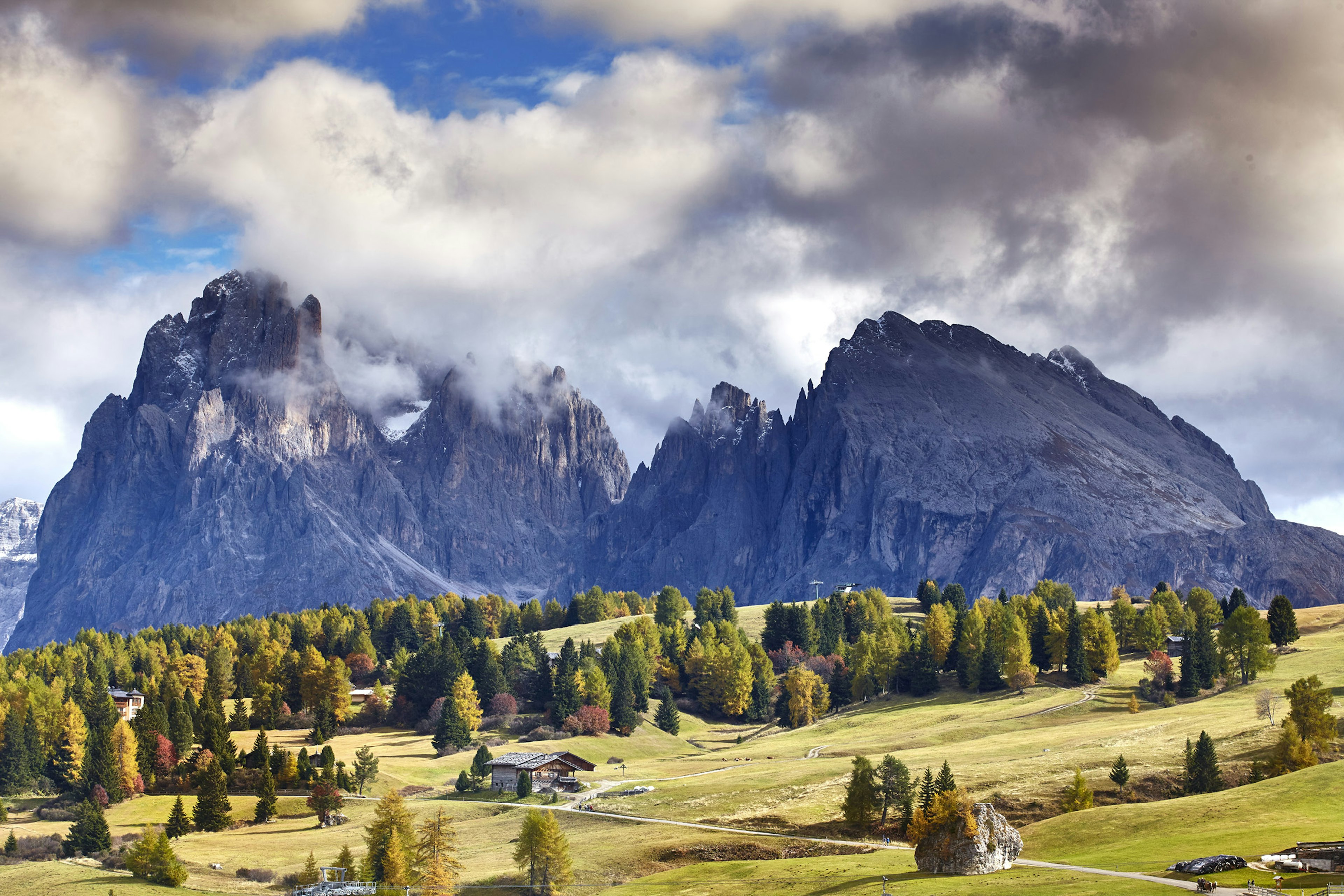 Under 3,000-metre-plus peaks, the Alpe di Siusi's trees begin to change colour