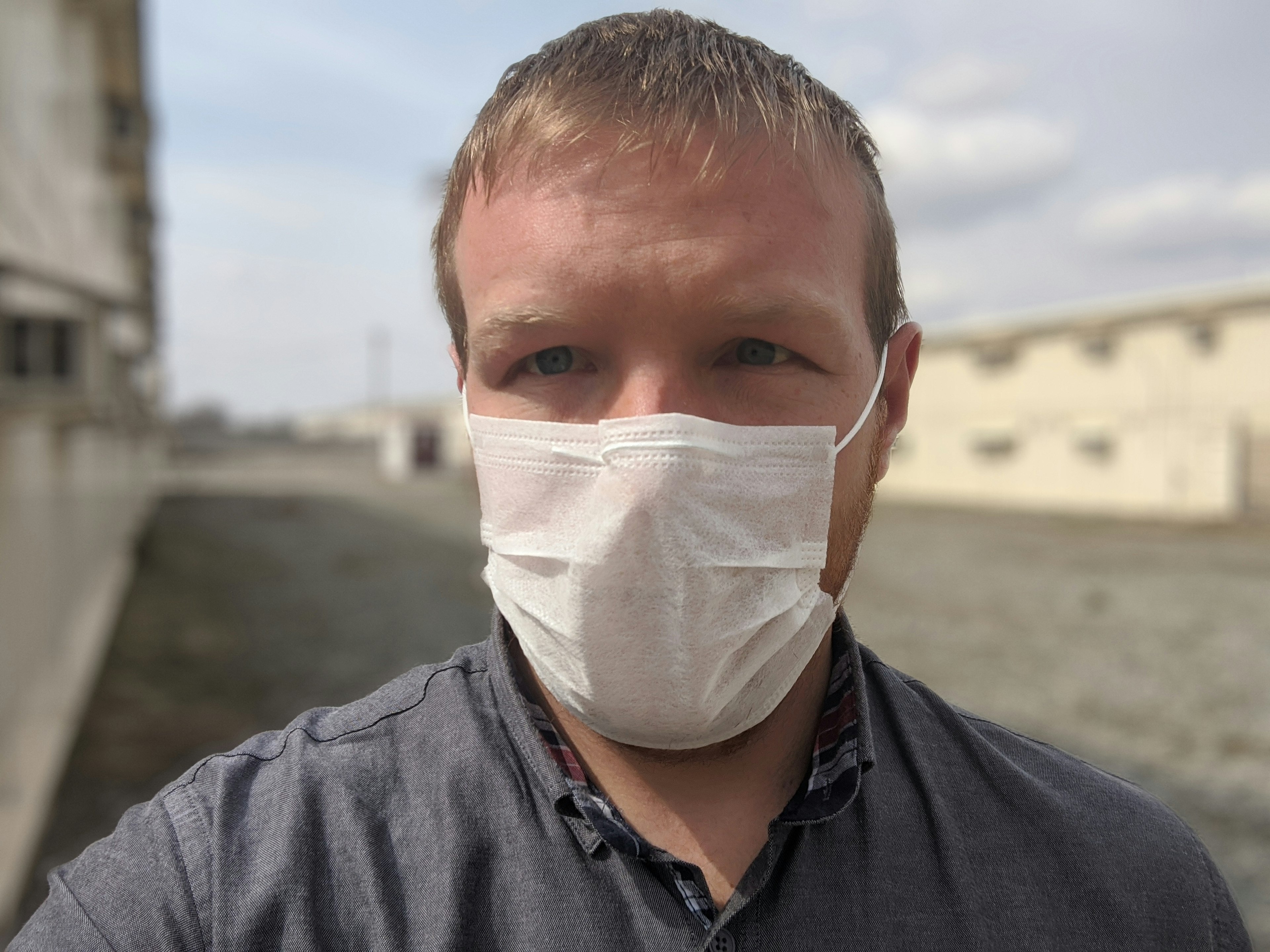 Stephen Lioy, wearing a face mask in the prison-like yard of a former military facility in Bishkek.