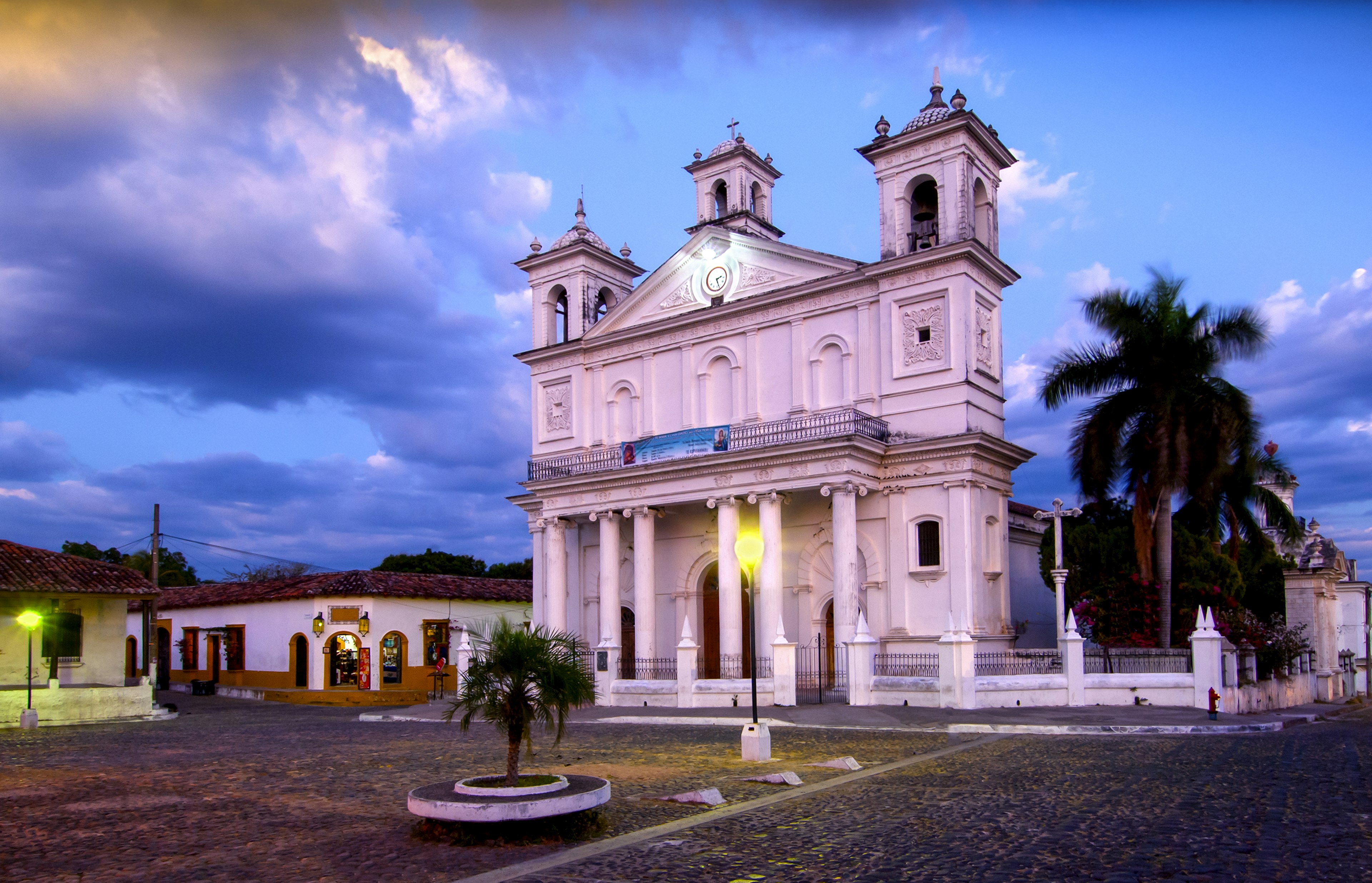 Santa Lucia Church is located in the tranquil colonial town of Suchitoto and has become a cultural symbol for the country of El Salvador. Located on the  Central Plaza, the 19th century church is a good example of post-colonial architecture in El Salvador.  The town's cobblestoned streets have attracted artists and art galleries over the years.
167875805
Architecture, Building Exterior, Christianity, Dusk, Cobblestone