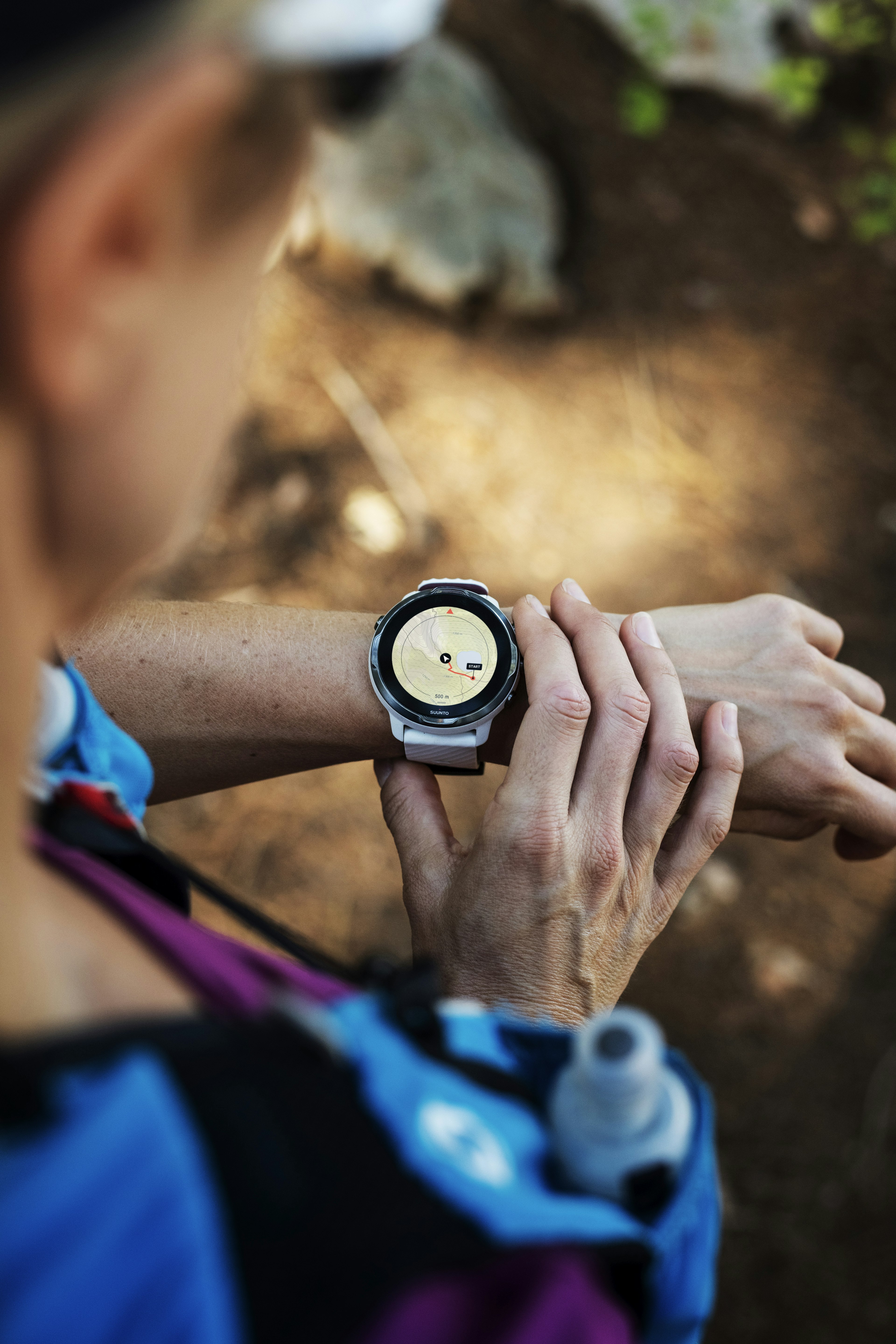 A person checks a map displayed on a smartwatch