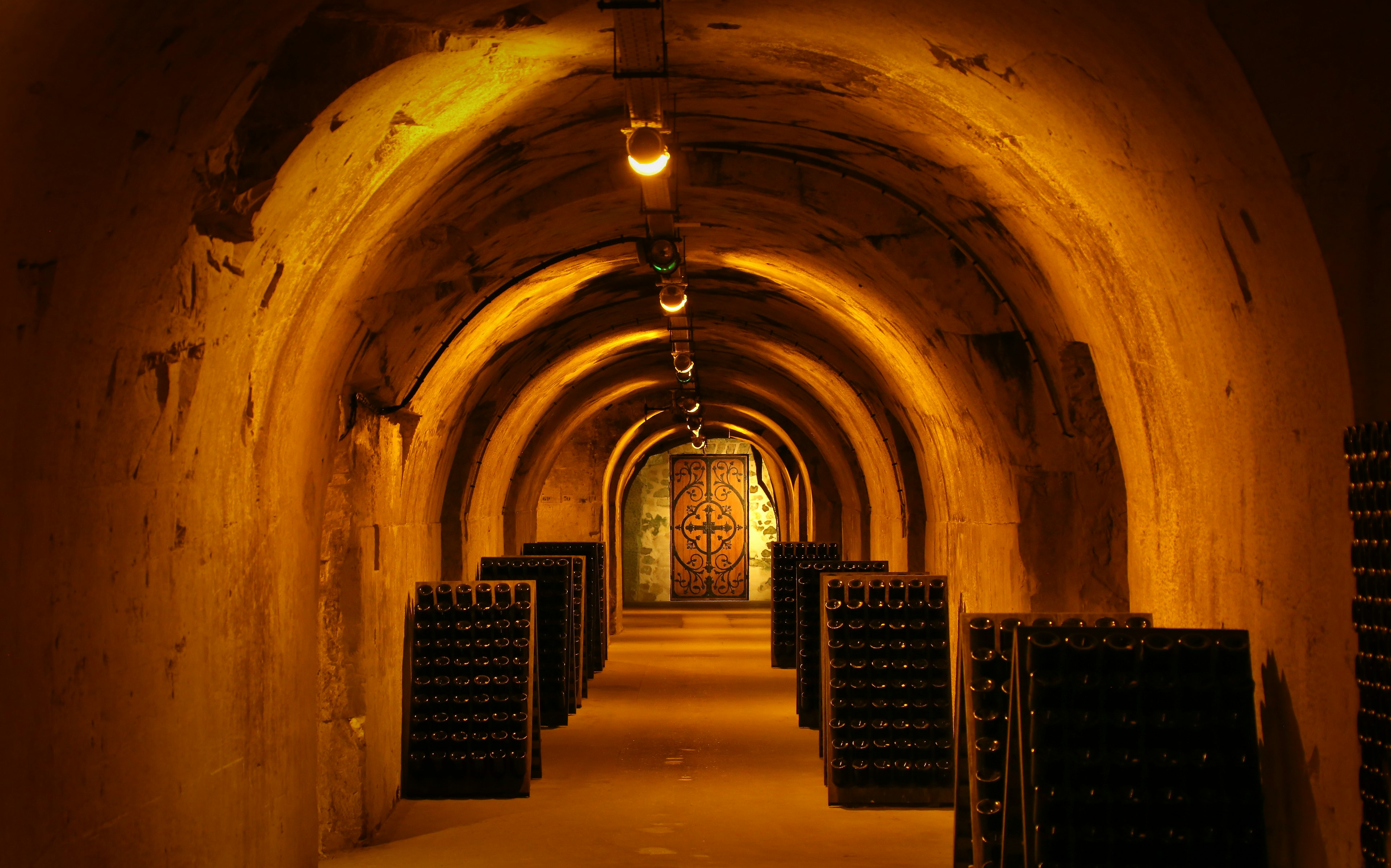 The dim lighting inside Taittinger Cave