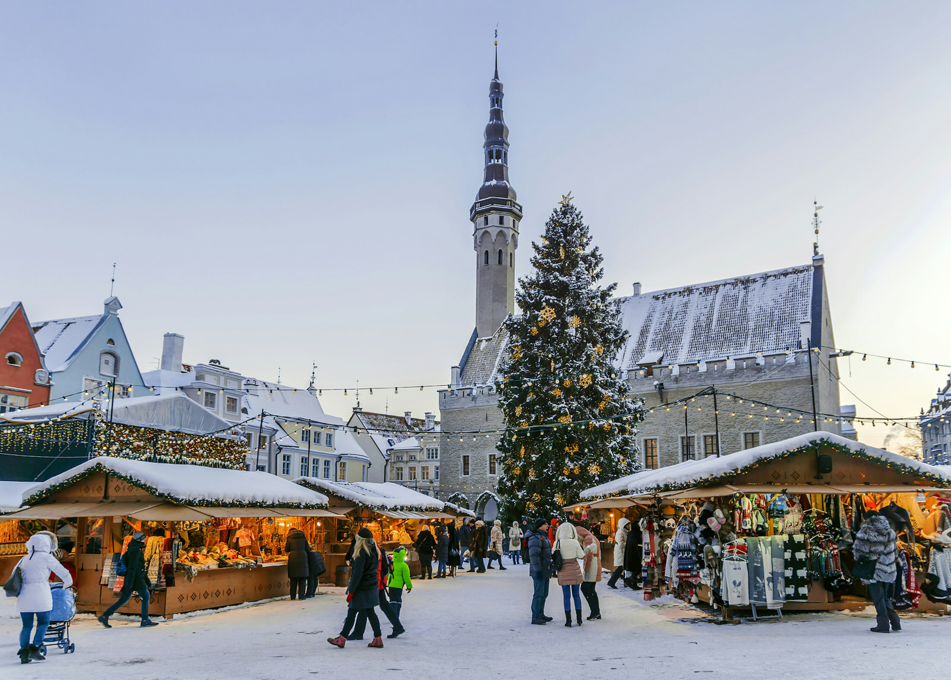 A snow covered Christmas market in a city's town square