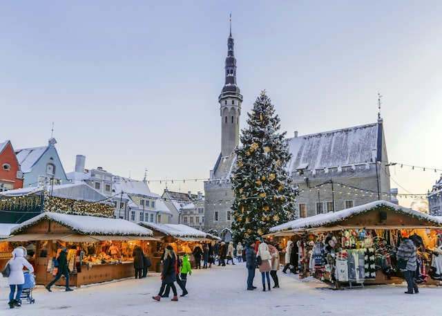 A snow covered Christmas market in a city's town square