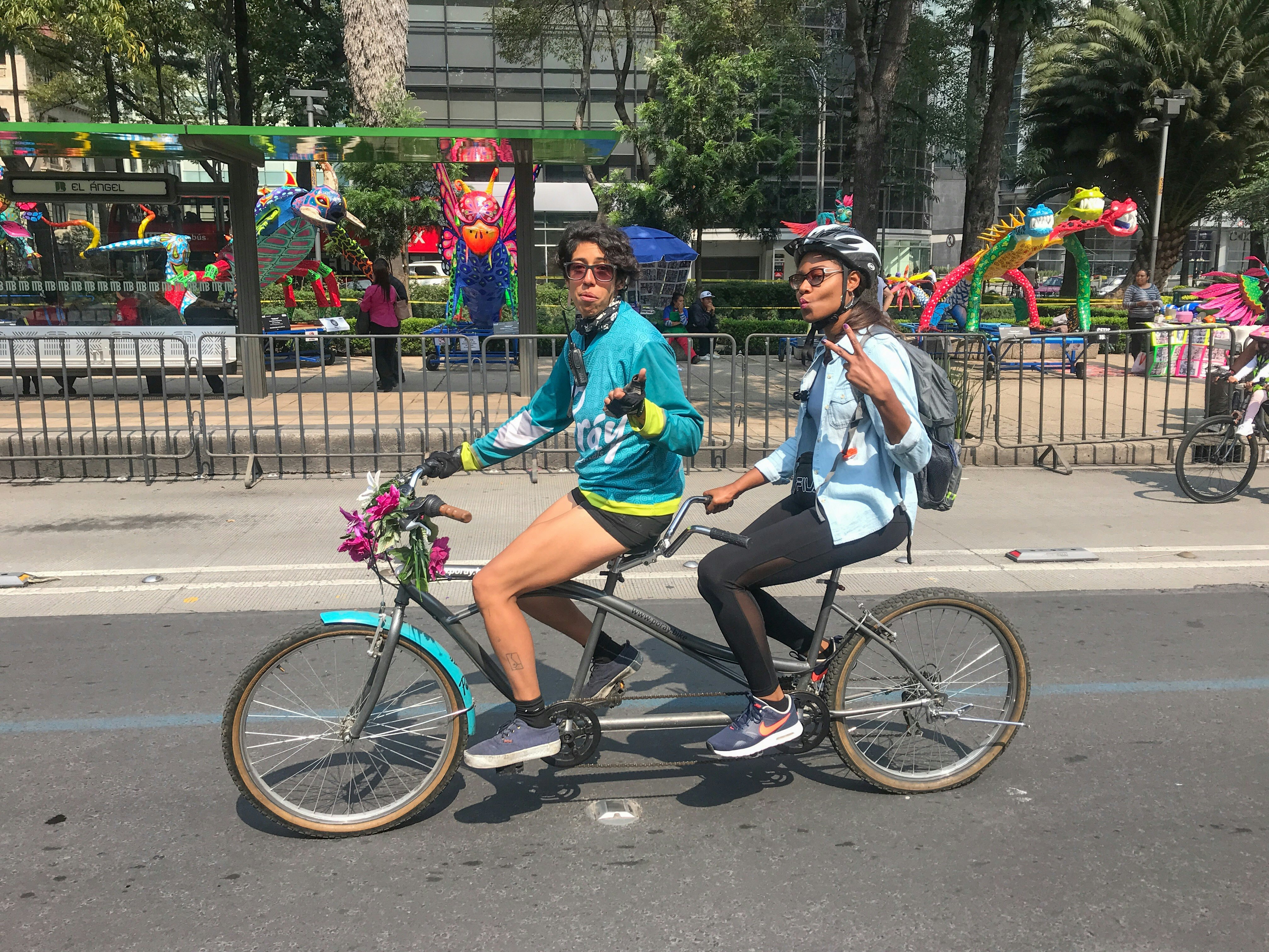 Two women on a tandem bike in Mexico City