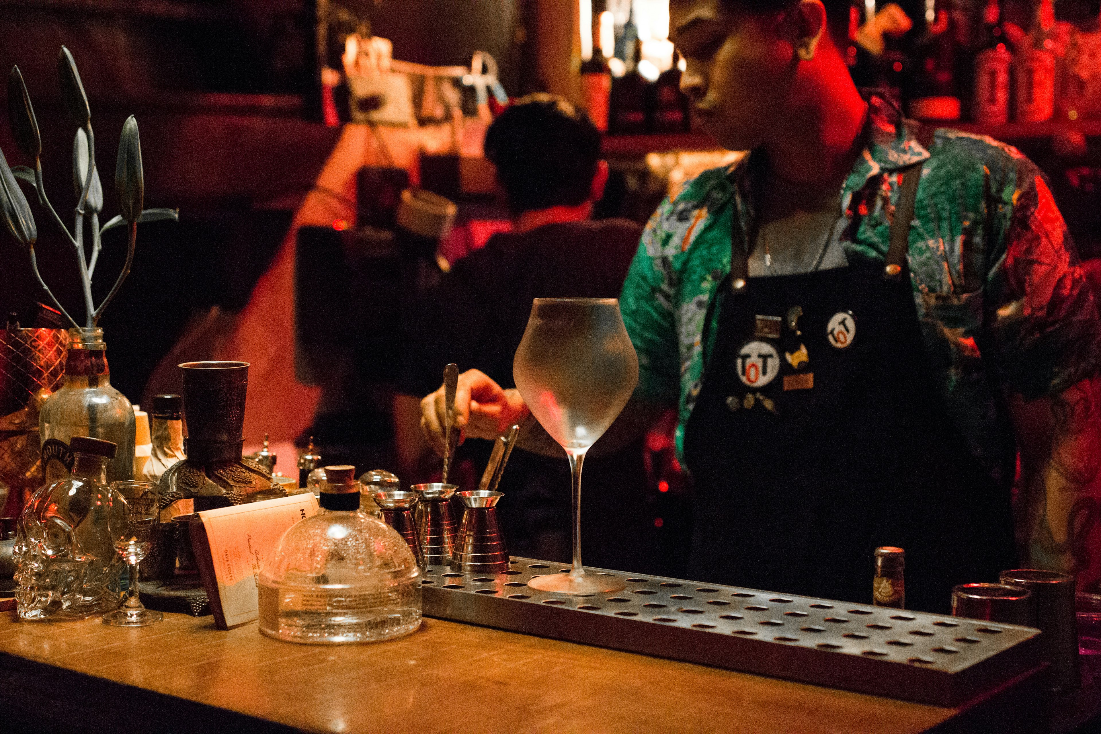 A member of staff at Teens of Thailand prepares a drink