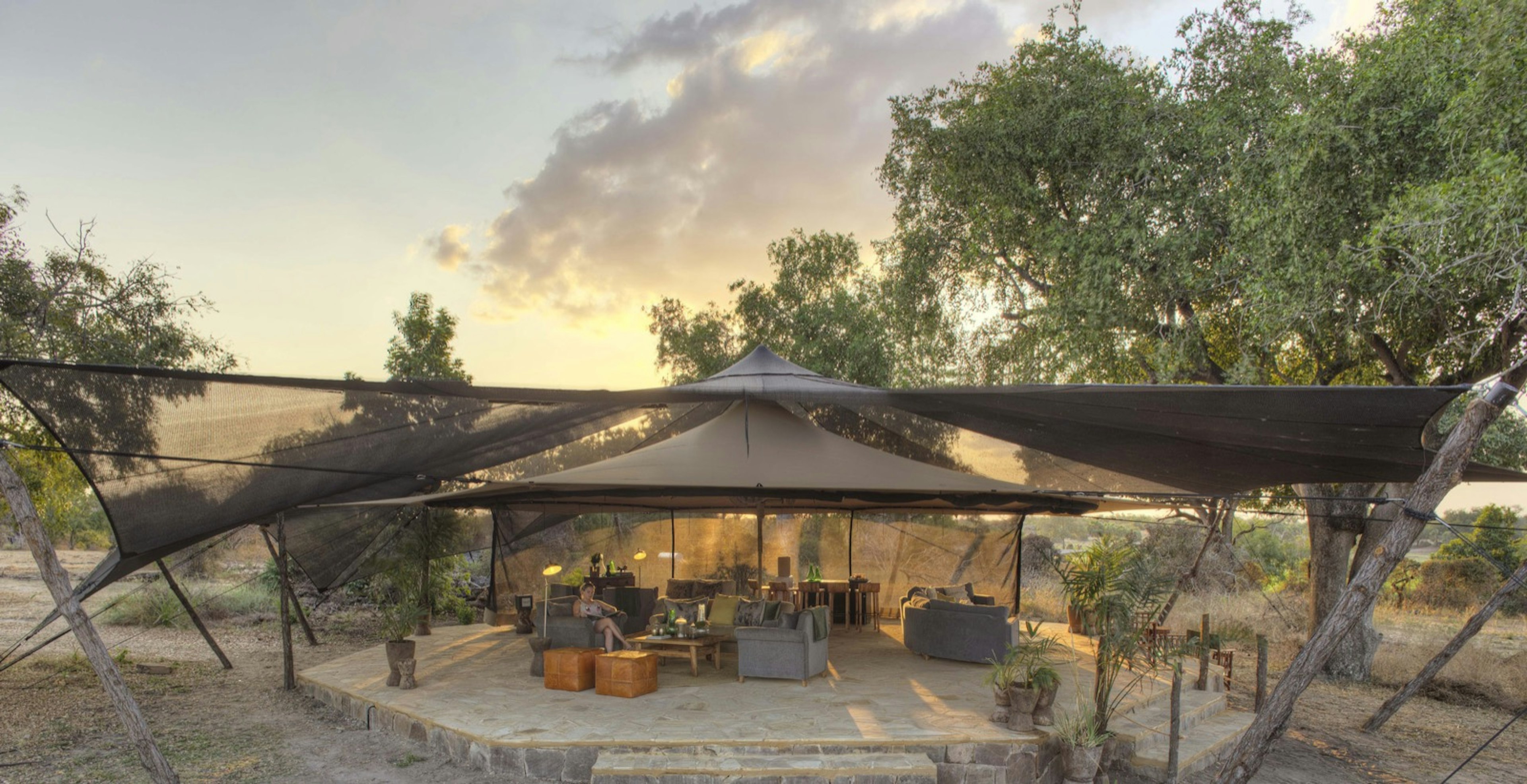 A canopy covering a lounge area under a sunny sky; all-inclusive resort adventures