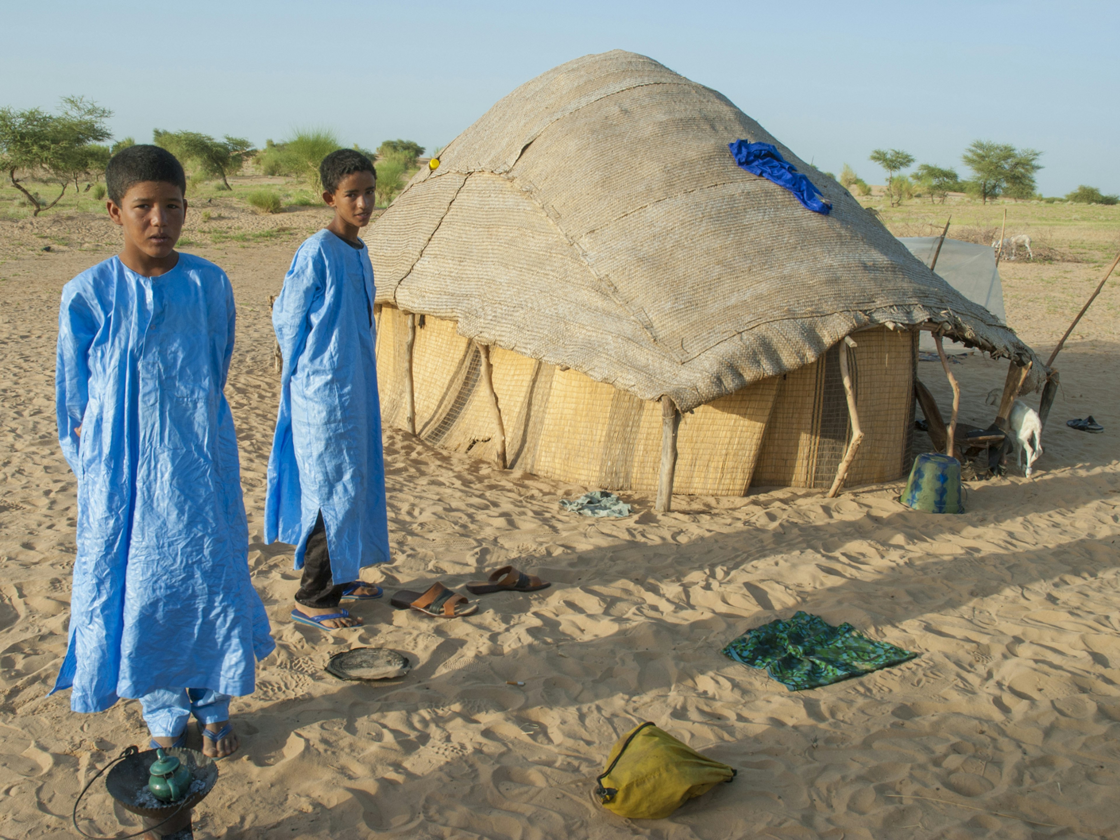 A Tuareg family in their traditional blue robes in Timbuktu, Mali © Marianoblanco / Shutterstock