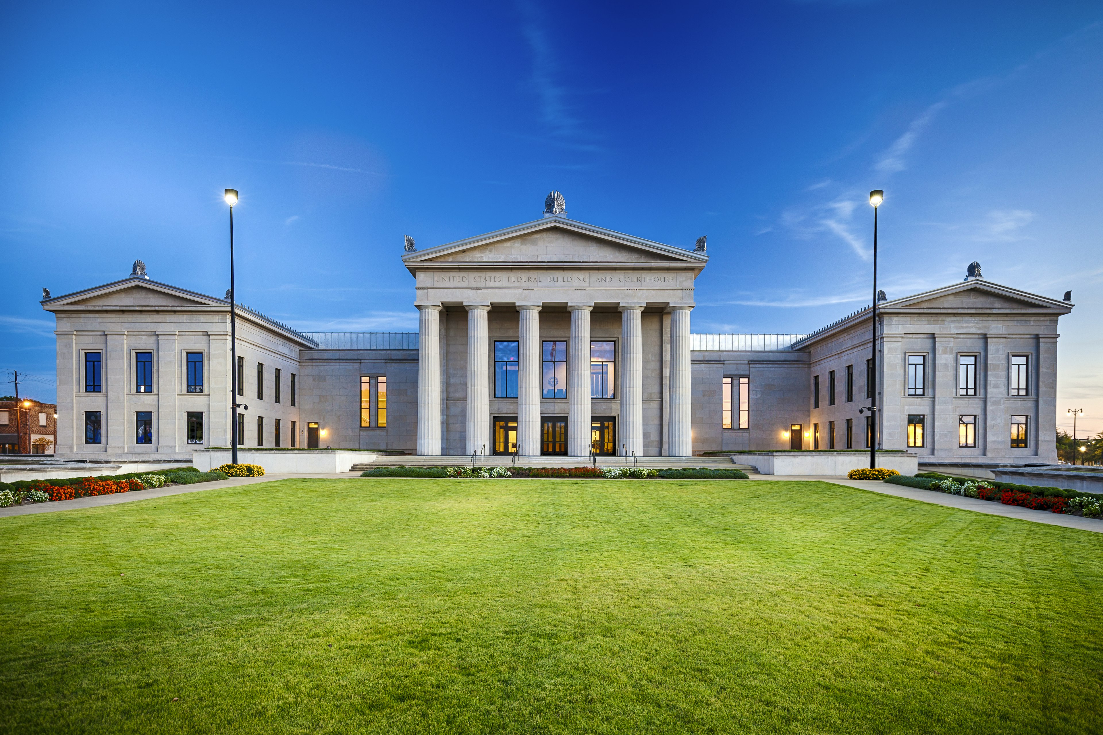 Exterior view of pillared and stone structures of the Alabama Federal Building and Courthouse; Auburn vs Tuscaloosa