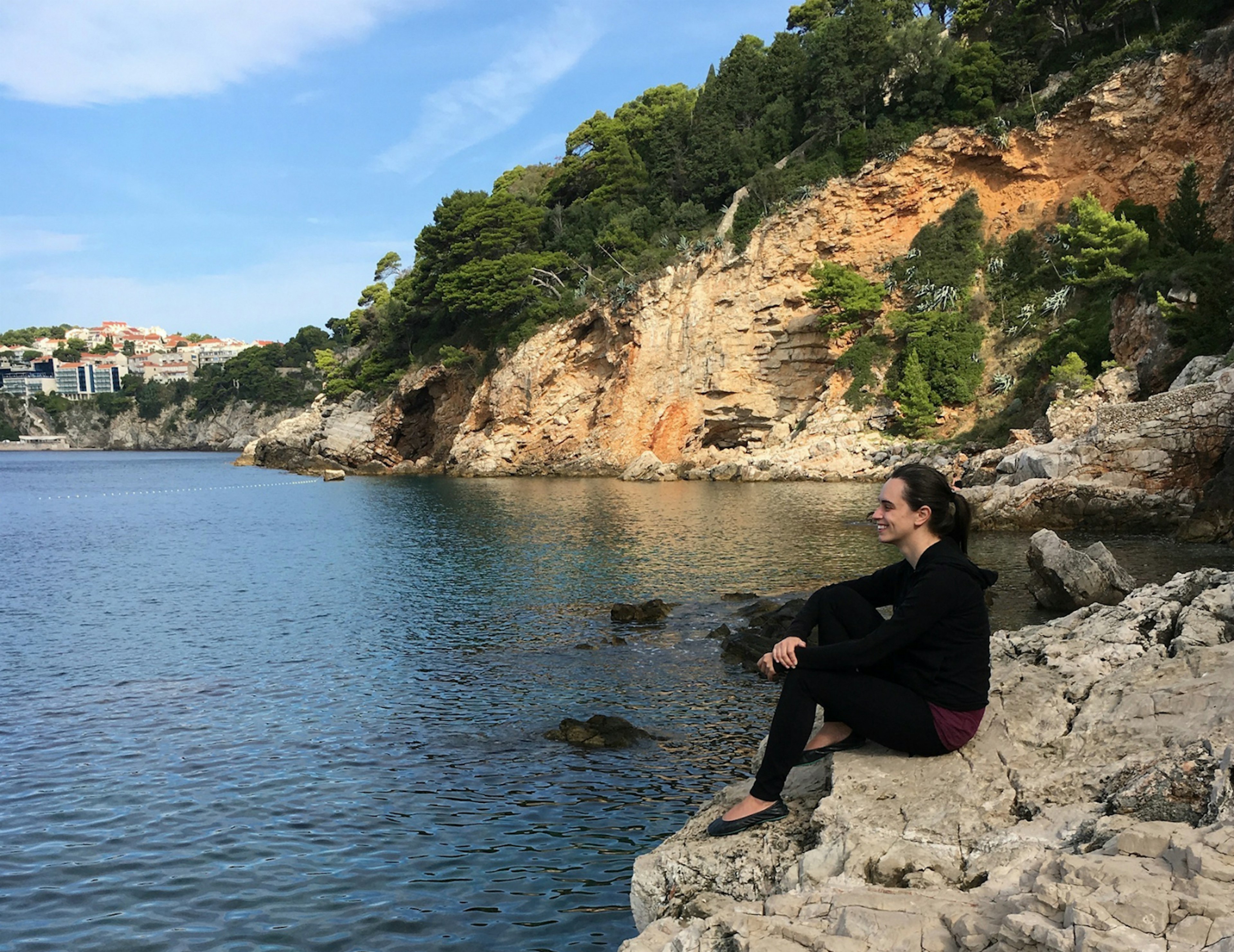 Valerie Stimac on a rocky coastline