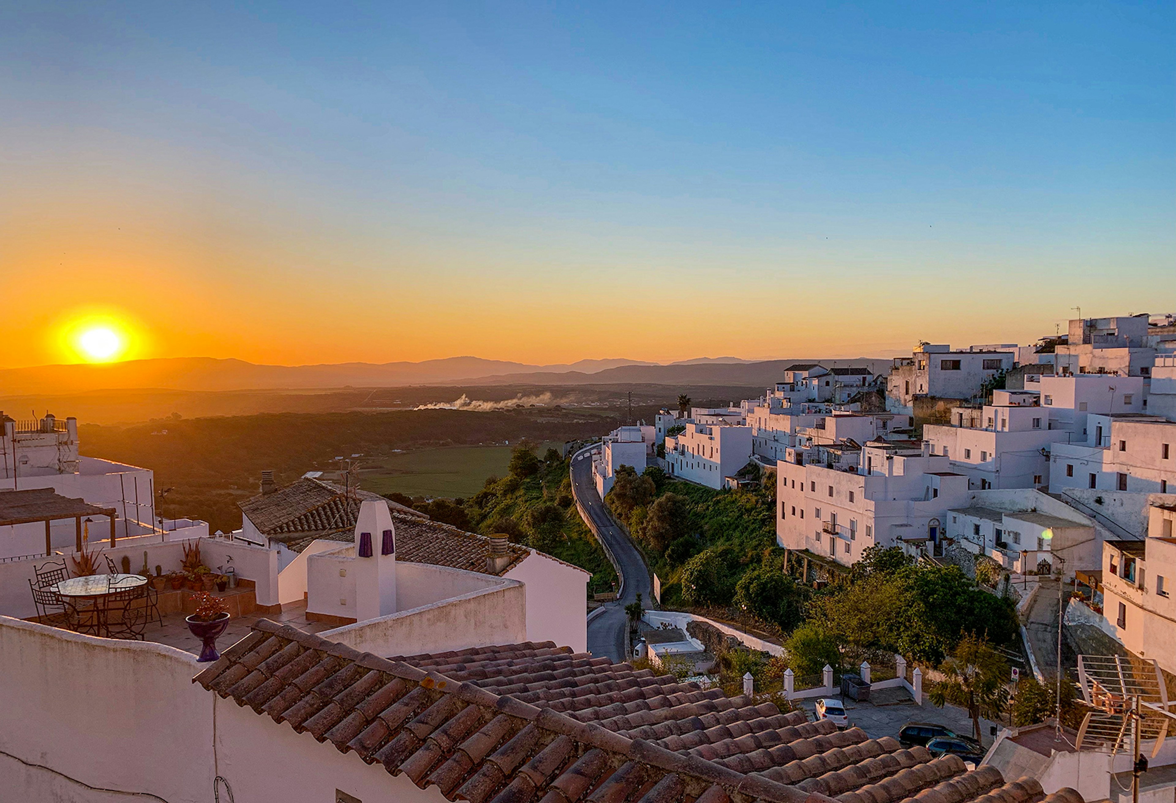 An aerial view of the white buildings of Vejer de la Frontera at sunrise. á徱, Spain.