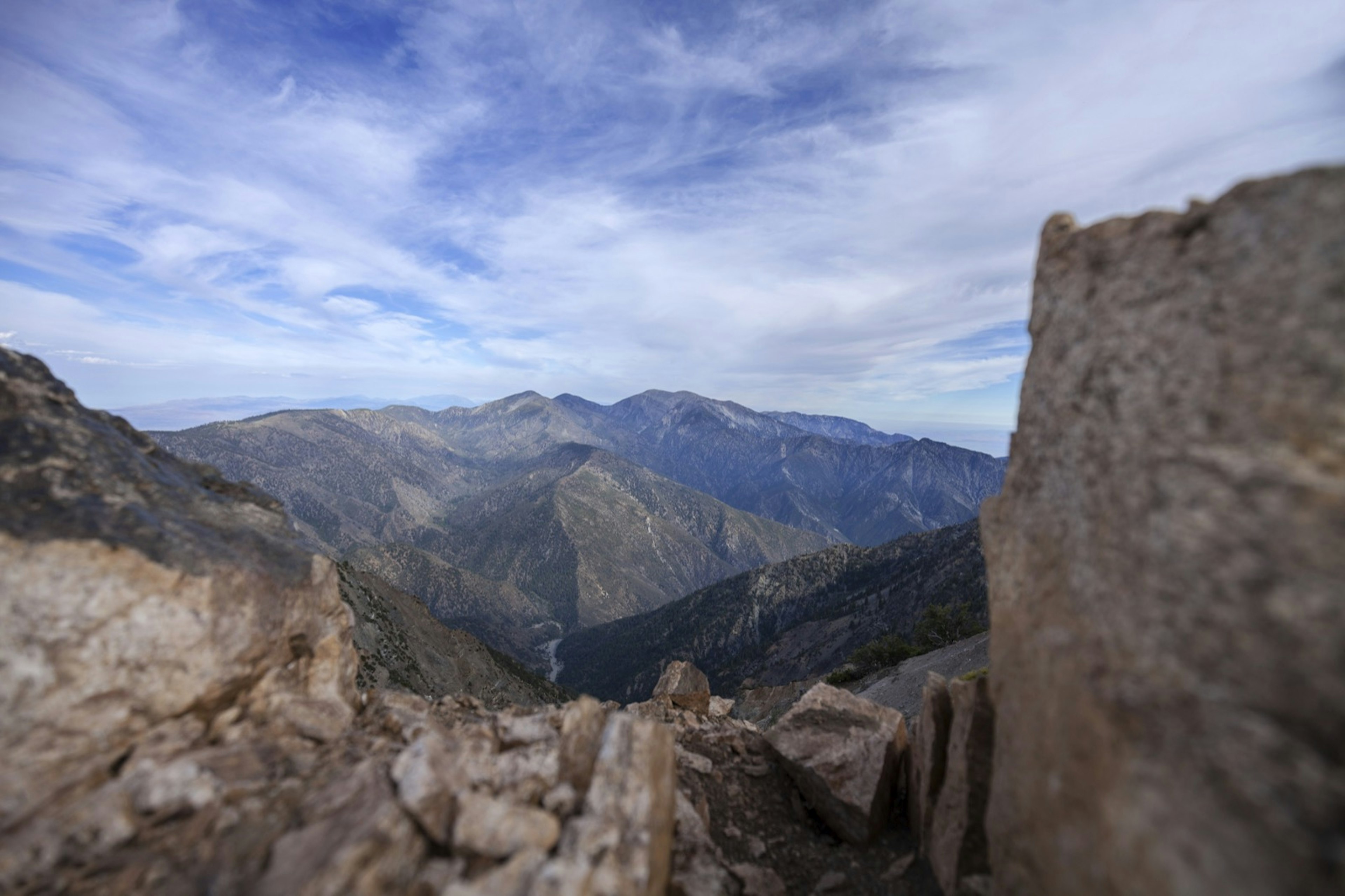 Mountain peaks dot the skyline from this high altitude view point