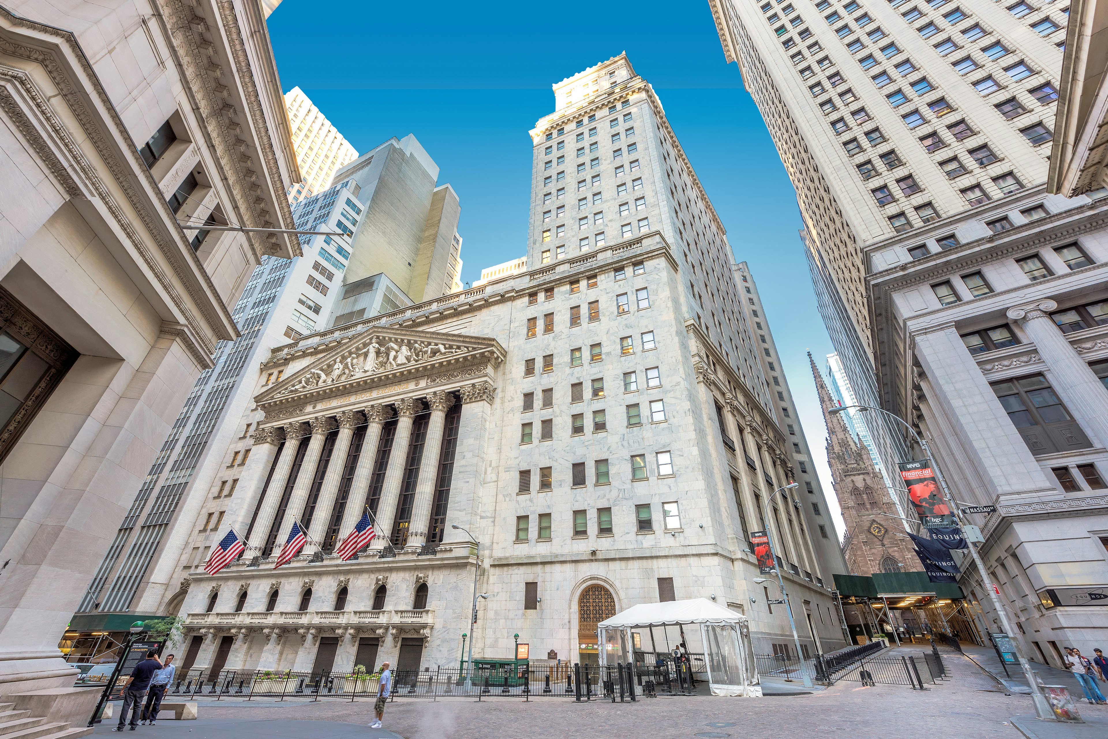 A view of Wall Street and New York Stock Exchange on a sunny day