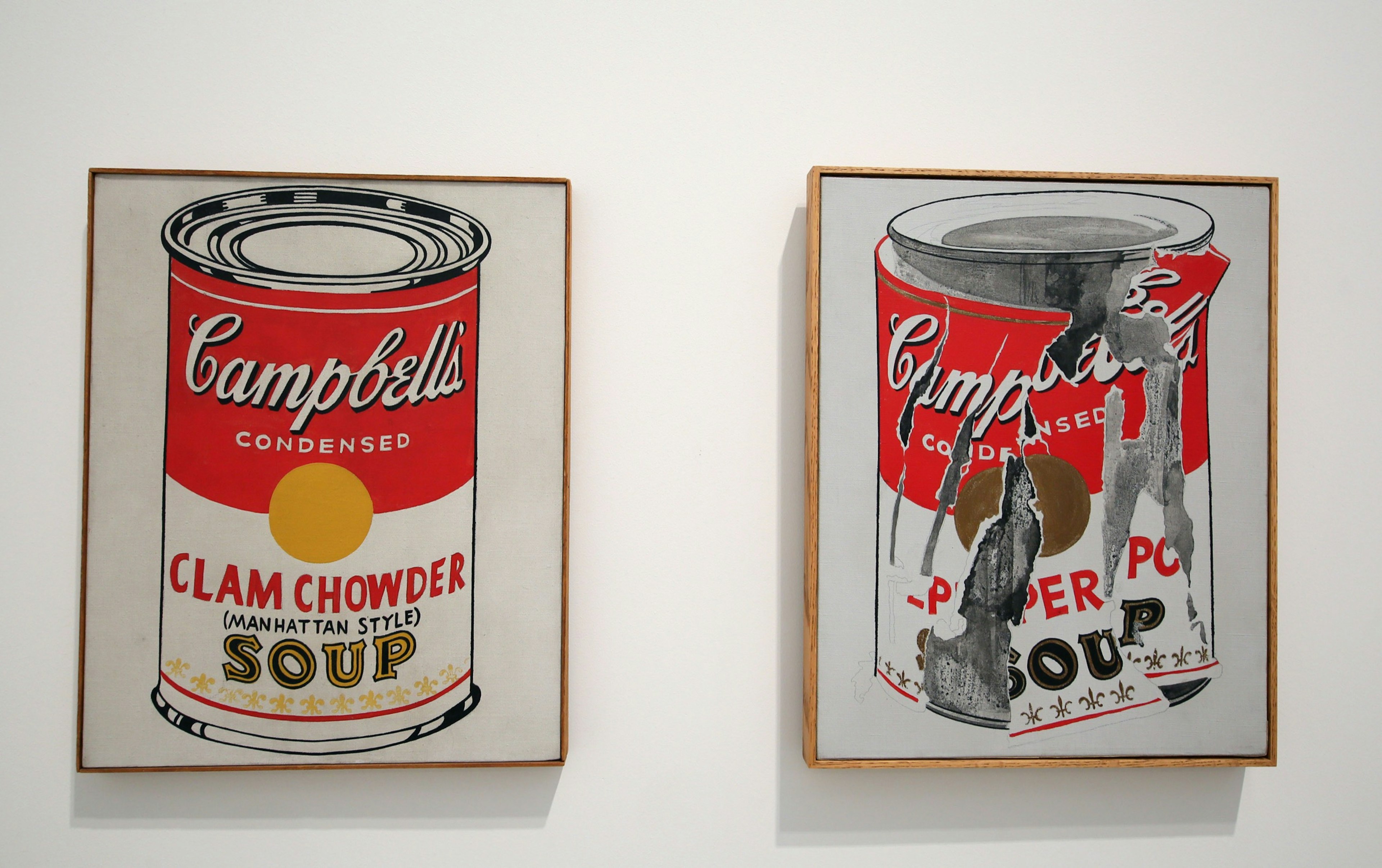 Images of Campbell's Soup Cans, one pristine and one shredded, are displayed at a museum in Los Angeles; Warhol in the US