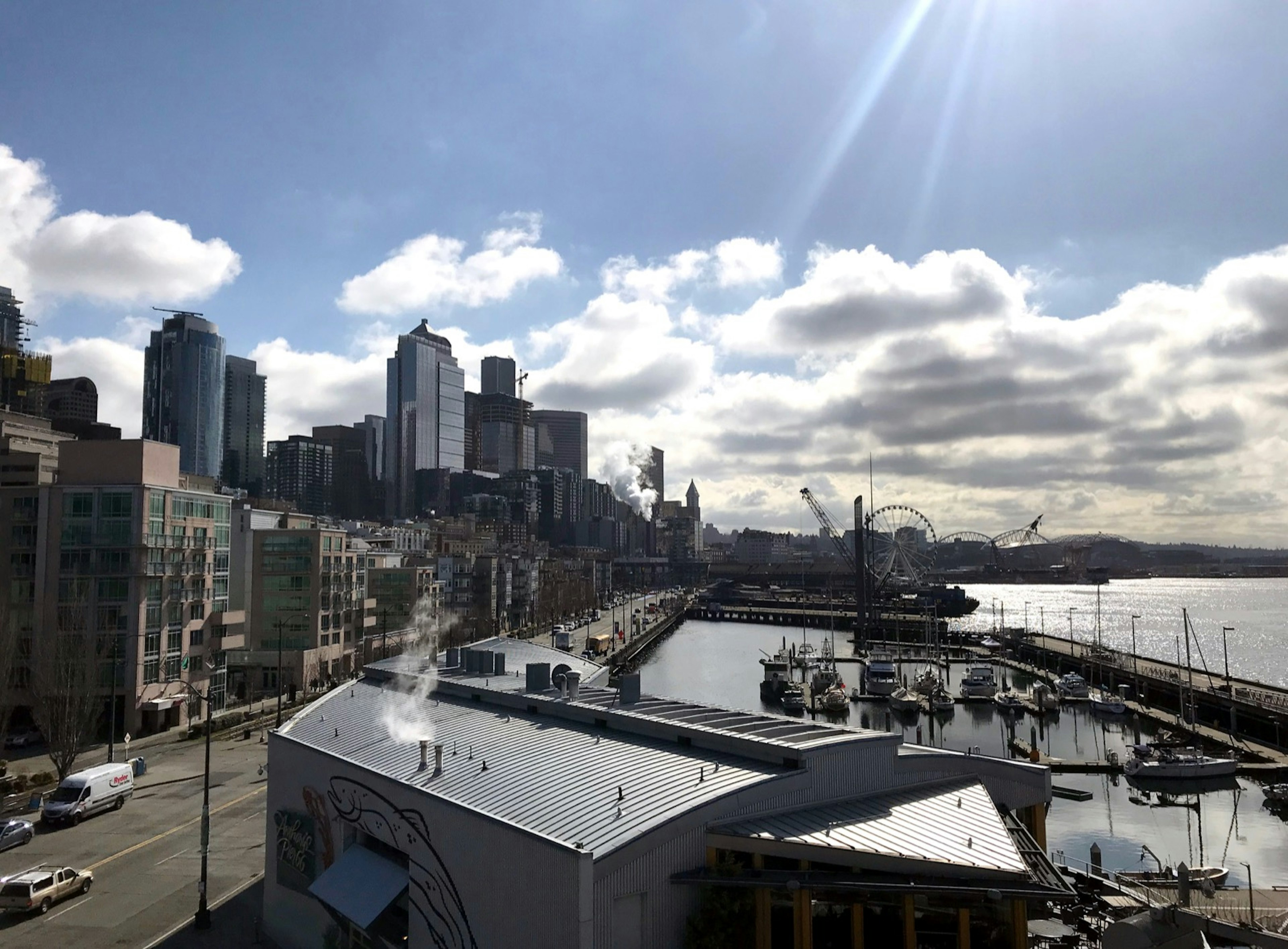 Light shines through some clouds over the Seattle waterfront. Perfect weekend in Seattle