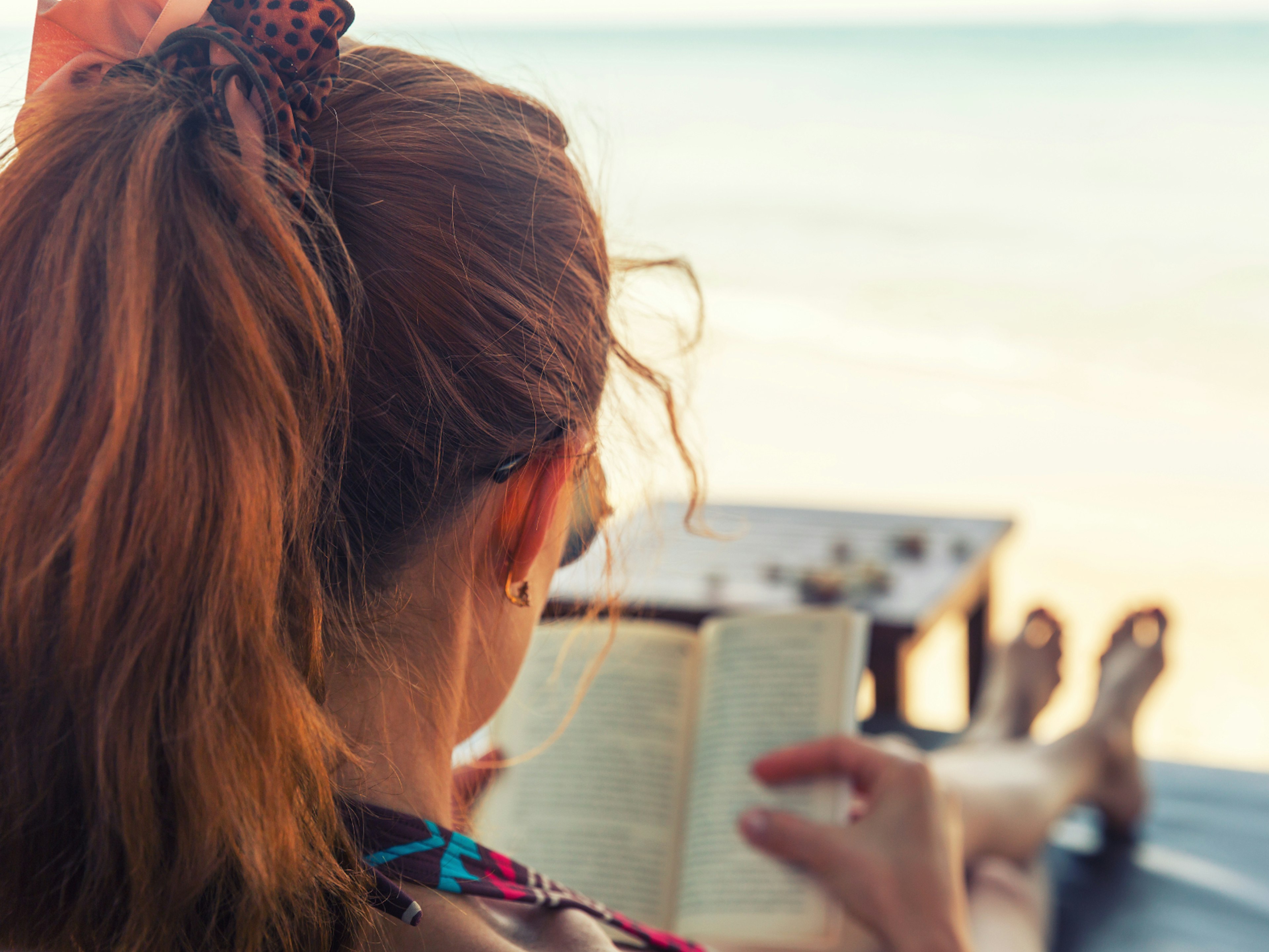 A woman relaxing reading a book