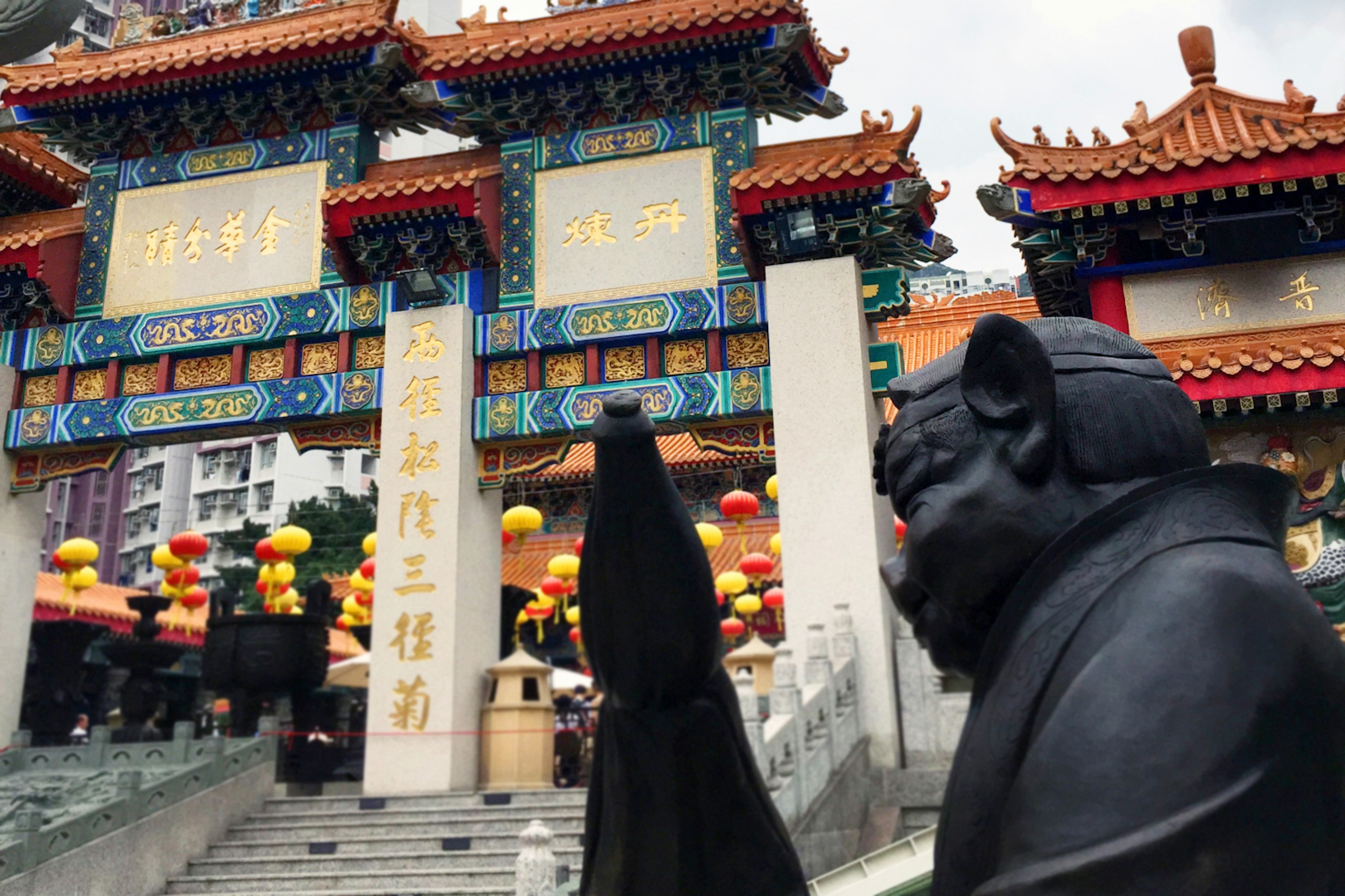 Year of the Pig: a Chinese zodiac statue guards the entrance to Wong Tai Sin Temple. Image by Tom Spurling / Lonely Planet