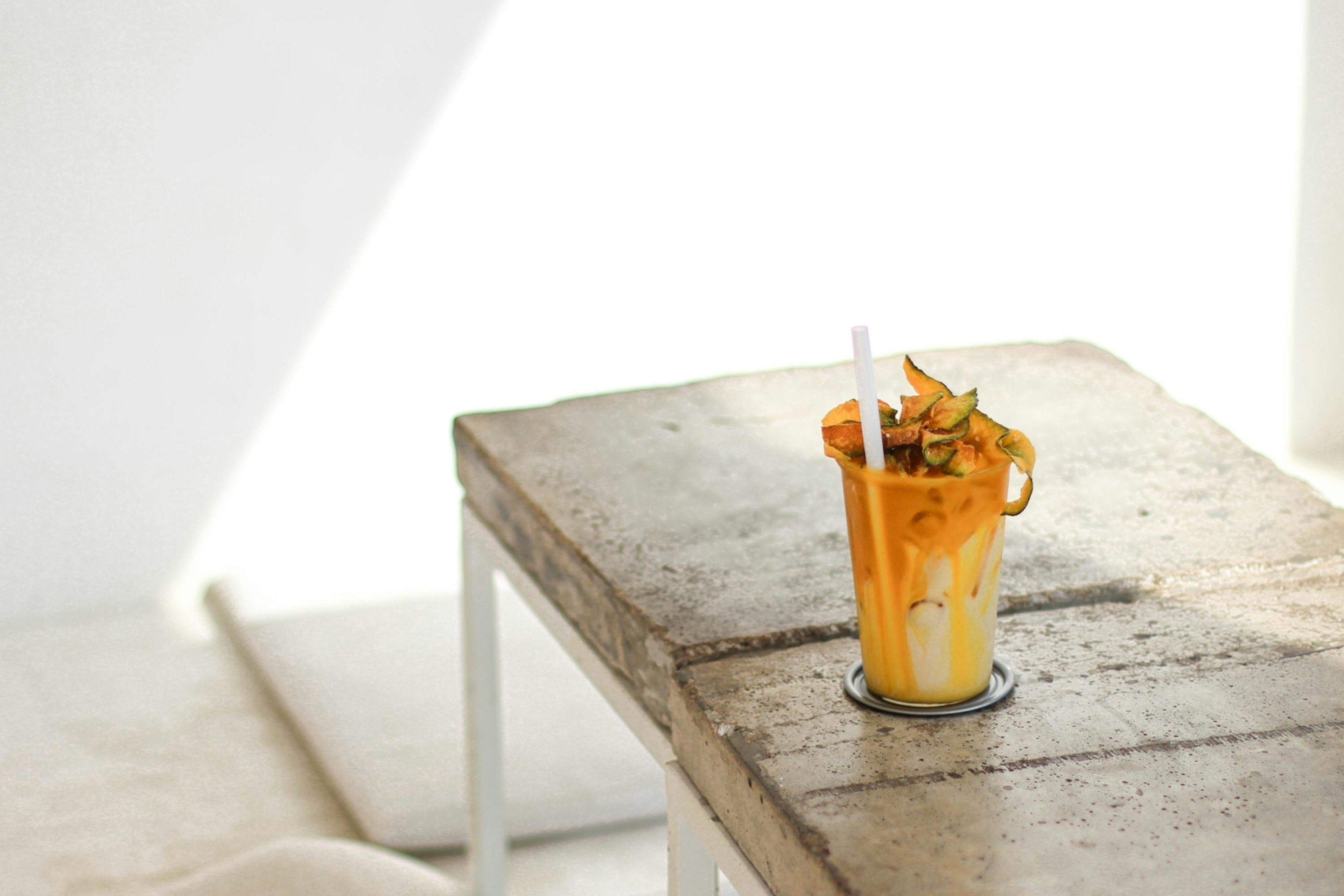 A photo of a yellow-hued coffee on a table in yellow Crafts Home Brewing in Chiang Mai