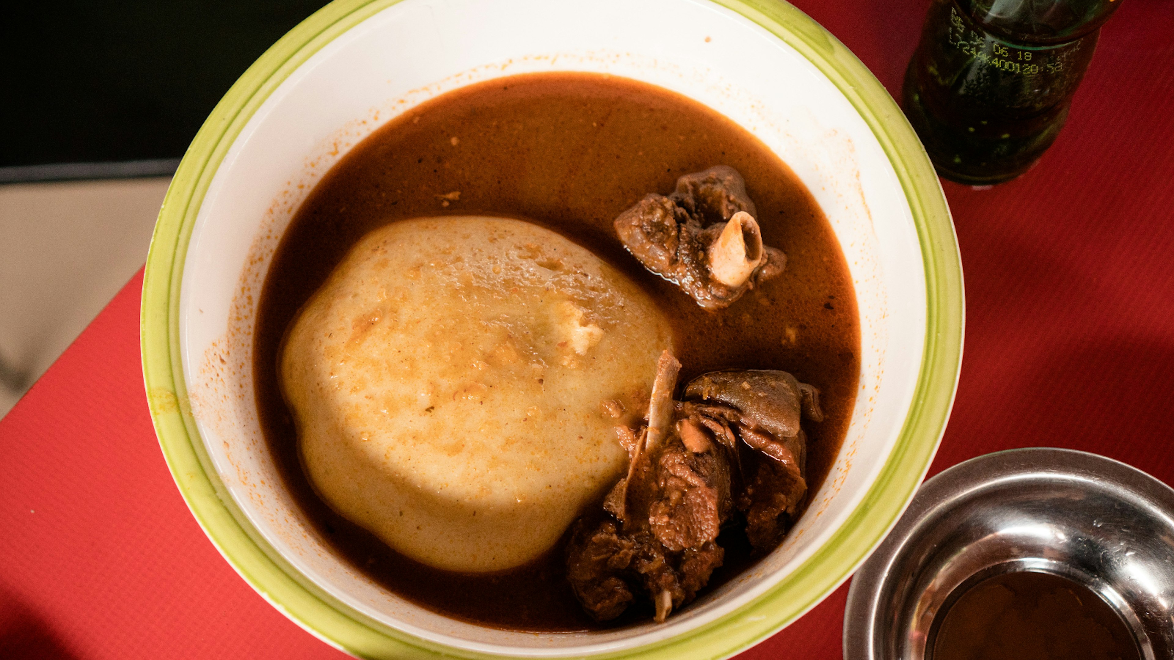 The legendary dish of fufu, here served in 'light soup' with goat meat at Asanka Local