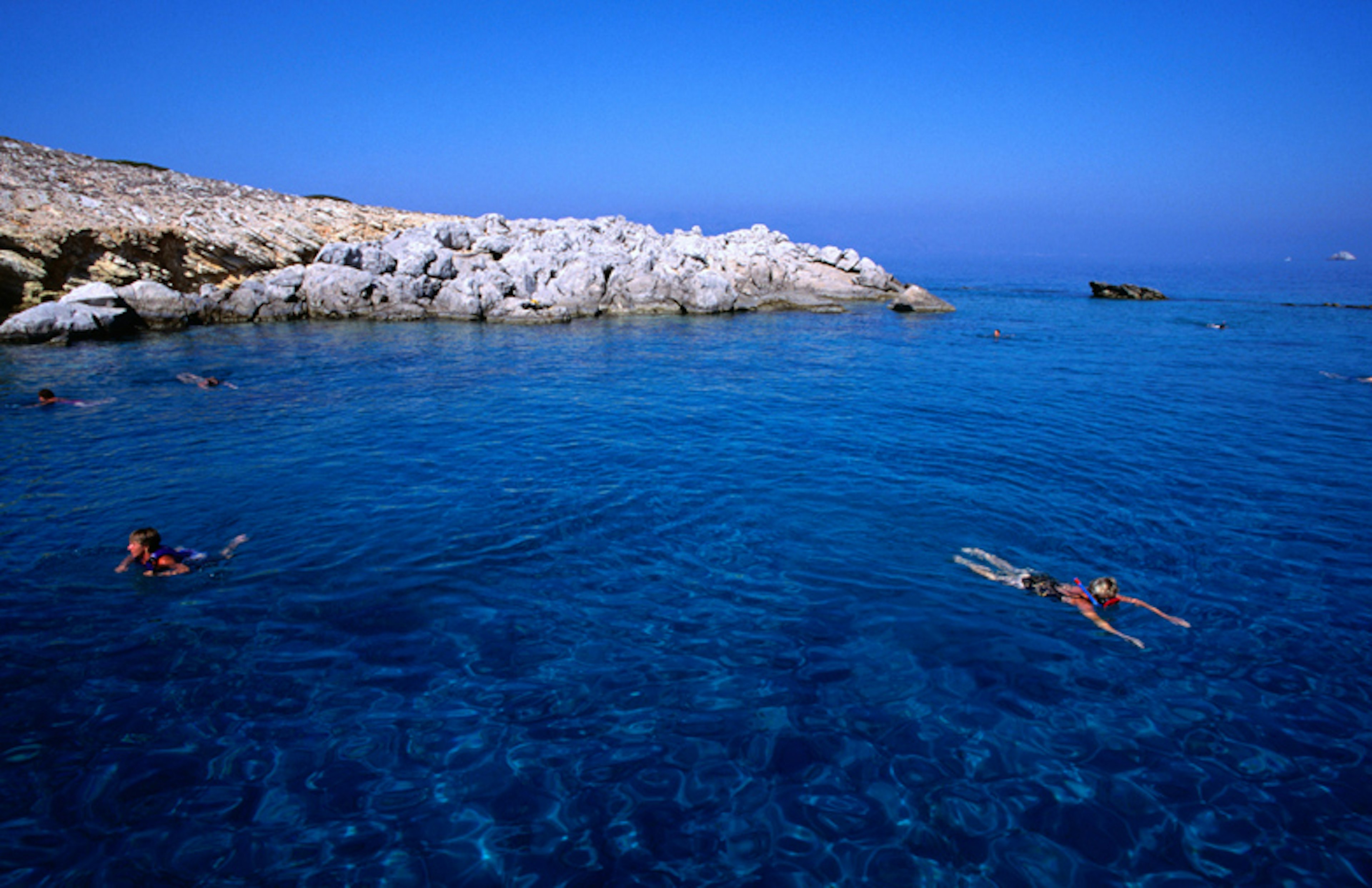 Go swimming in Greece. Image by Wayne Walton / Getty Images.