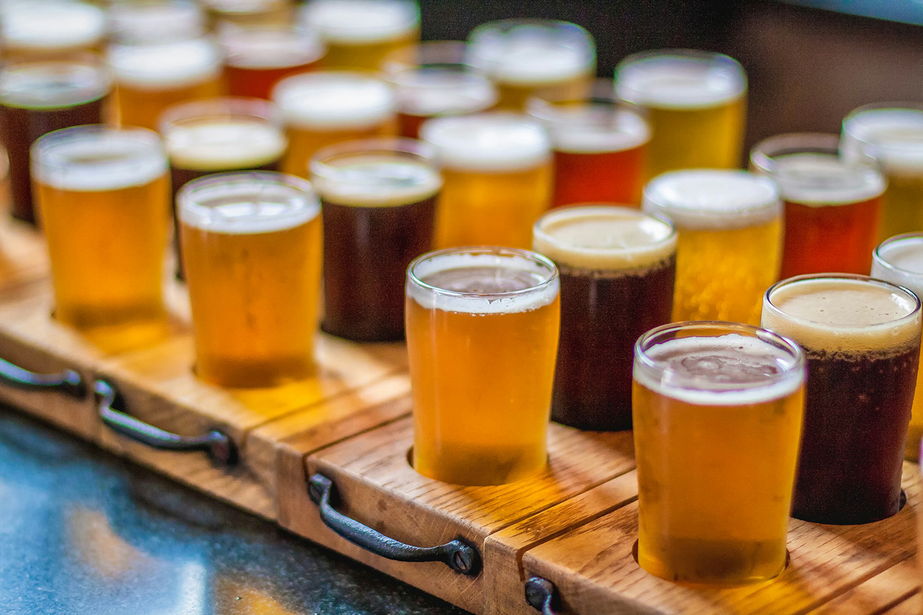 beer tasting glasses are lined up on a table