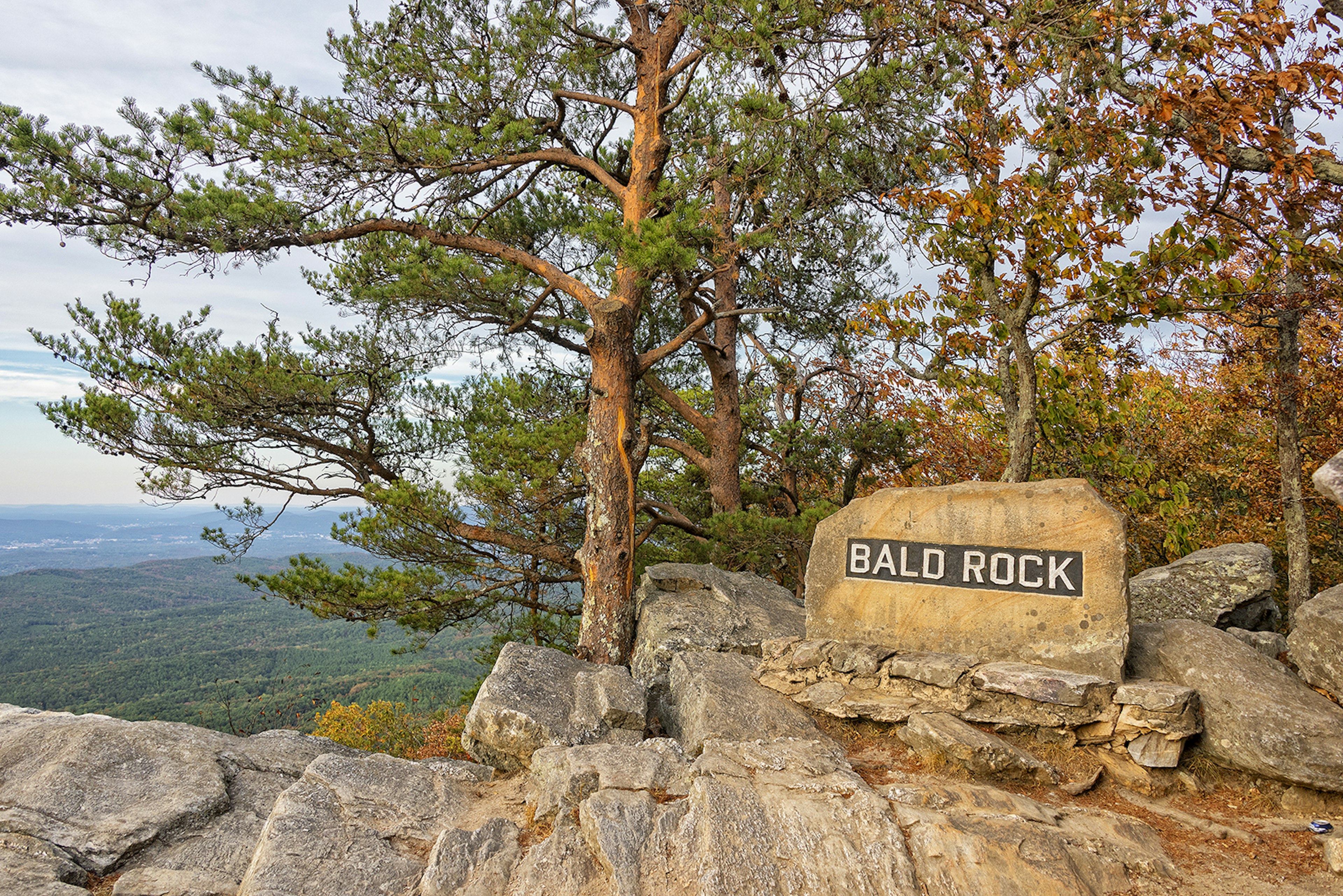 Rock sign saying 'Bald Rock' at a viewpoint over much of Northeast Alabama, near the top of Mt Cheaha